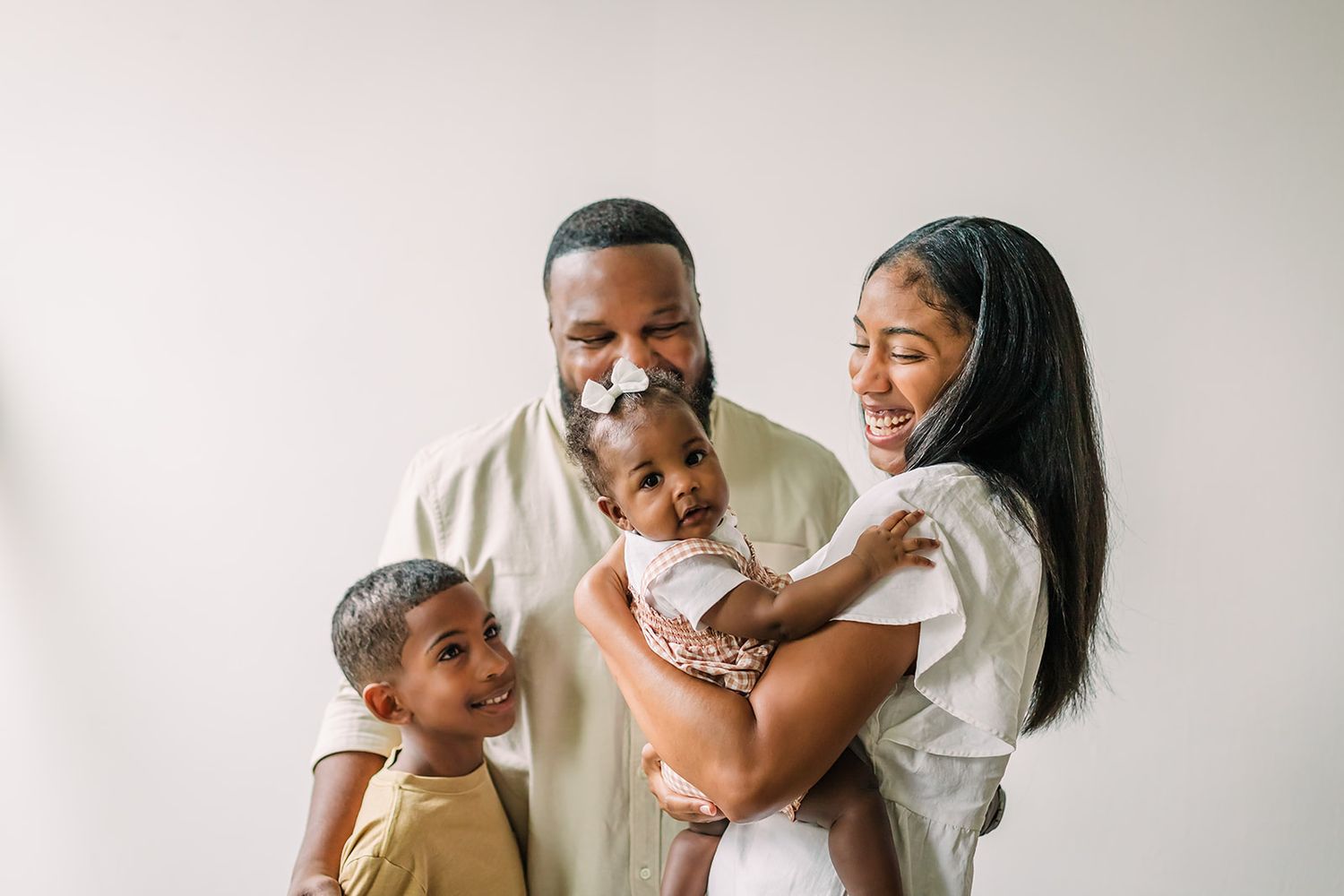 Joyful family moments captured during indoor lifestyle photo session.