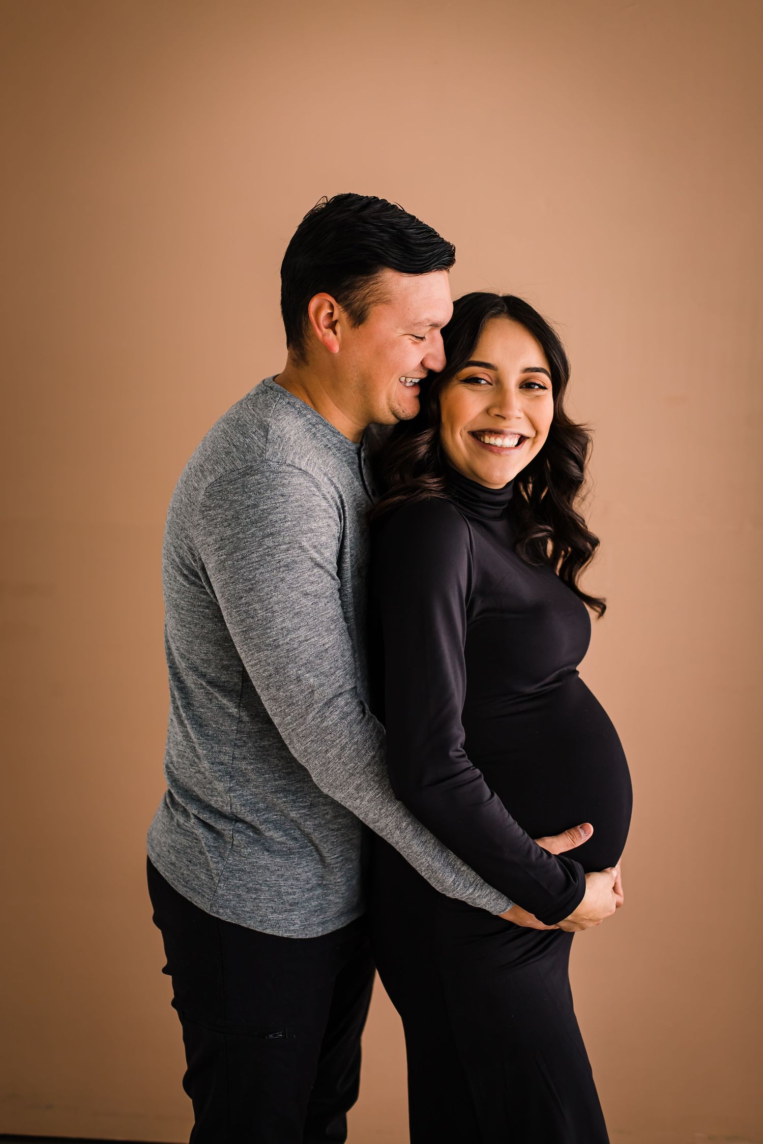 mom and dad at studio maternity photoshoot