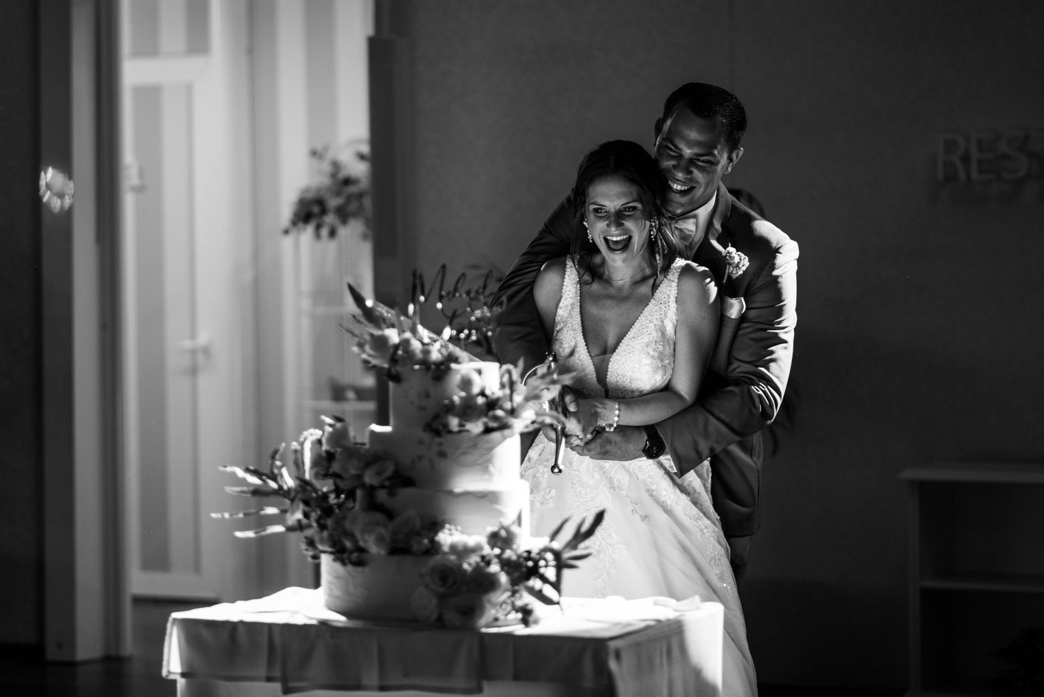 Dramatic black and white wedding photos showing intimate moments during the ceremony.