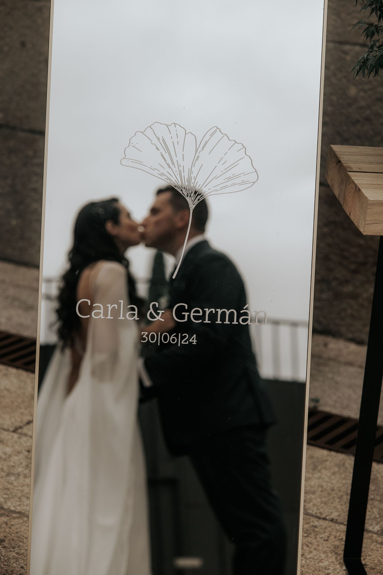 Artistic black and white wedding photo sequence showing couple's romantic silhouettes against white background.