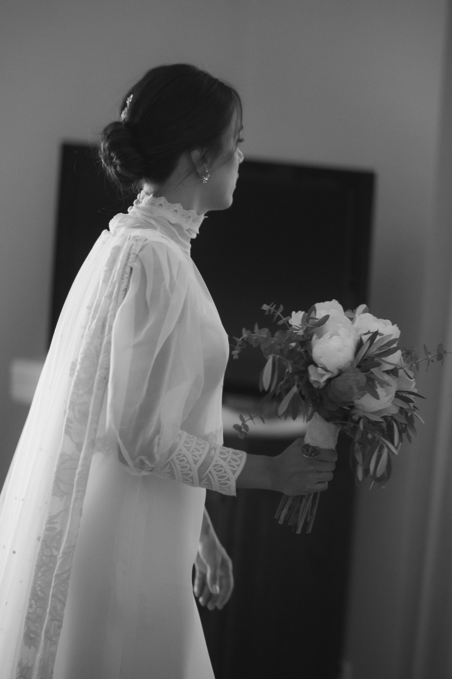 Series of artistic black and white photos showing a bride in a lace dress holding a bouquet in an indoor setting.
