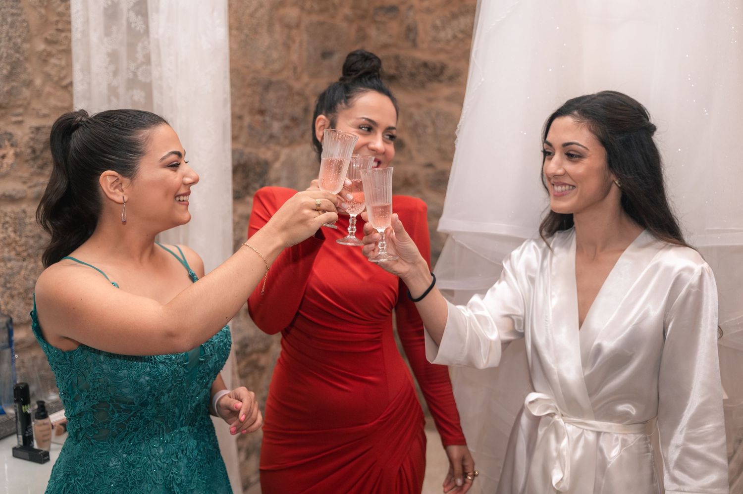A group in formal attire sharing joyful moments and laughter during a celebration.