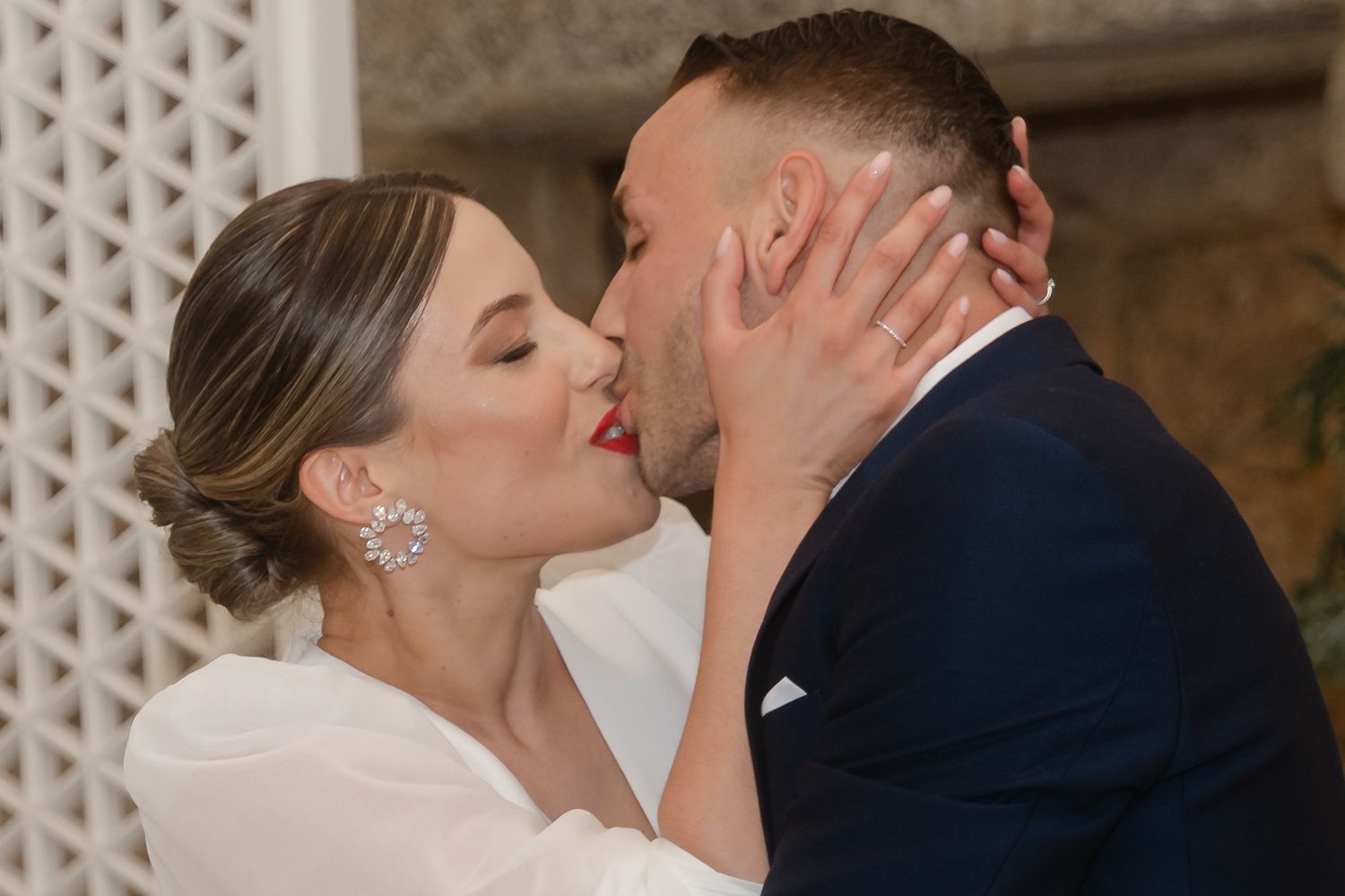 A romantic wedding photo collage showing tender moments between a bride and groom against a decorative wall background.