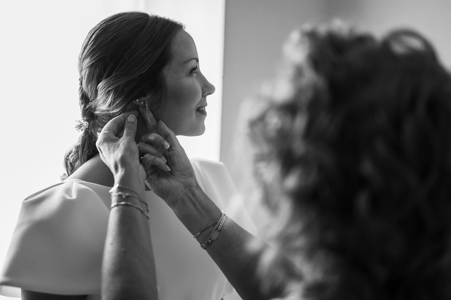 Black and white photo series showing silhouettes of people in emotional moments and embraces.