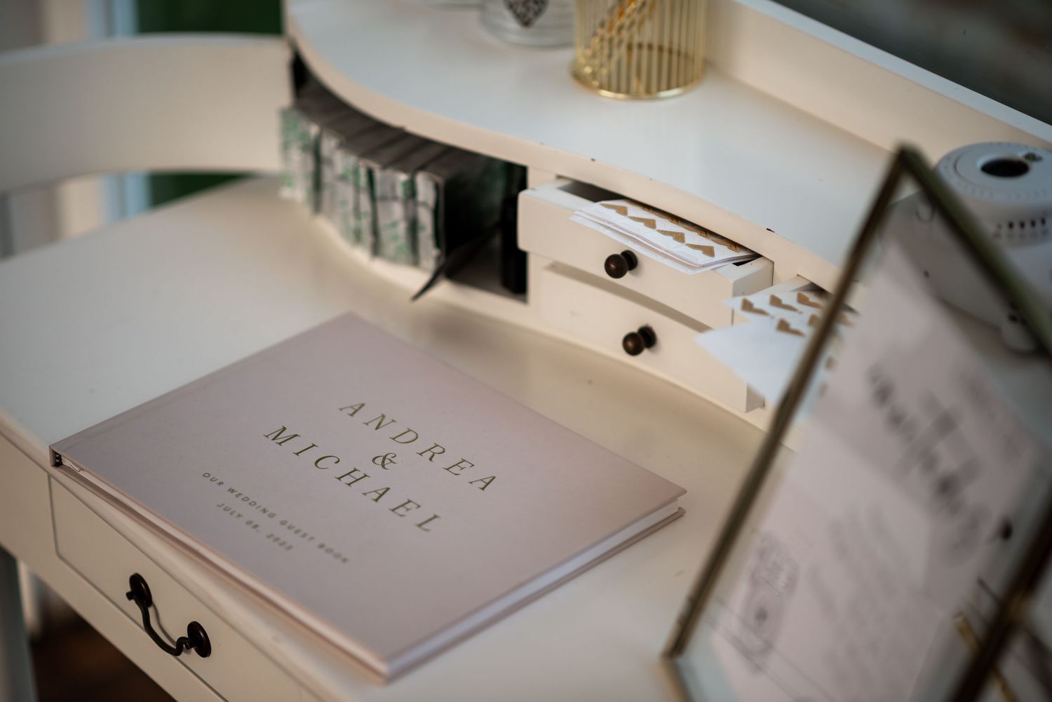 Wedding invitation suite and stationery displayed elegantly on a white surface with delicate details.