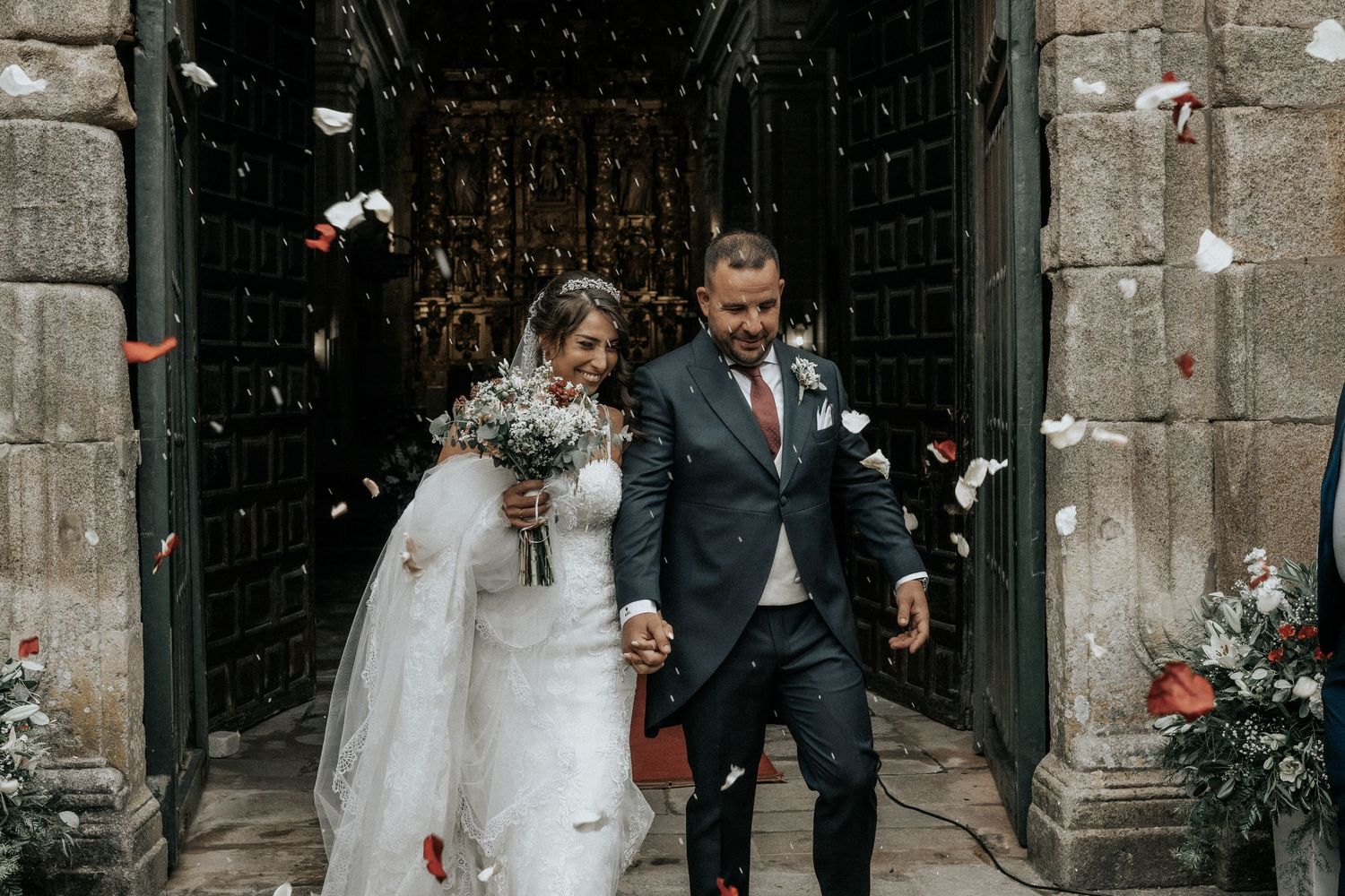 Stone church wedding venue decorated with floral arrangements and elegant details for a romantic ceremony.