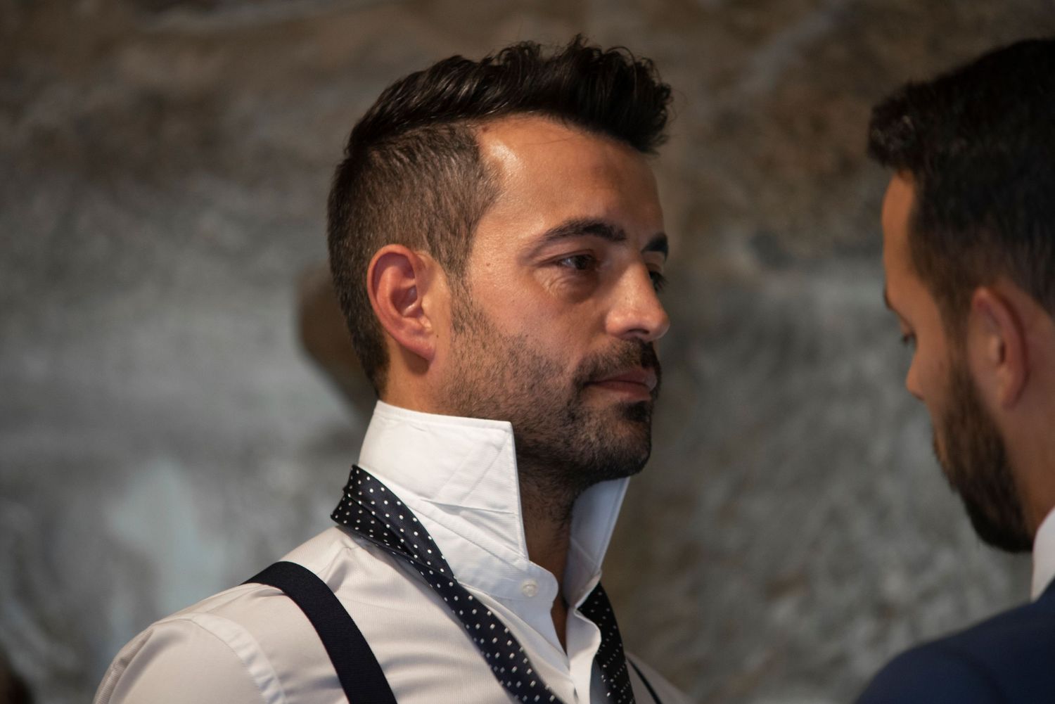 A series of black and white profile portraits showing a man's facial hair and style evolution.