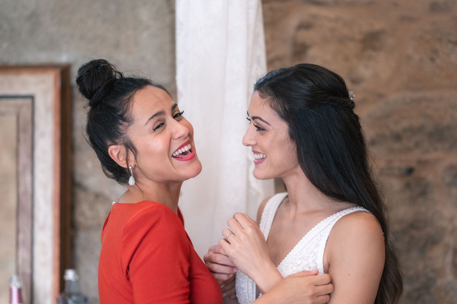Candid moments of joy and laughter between two people during a celebration.