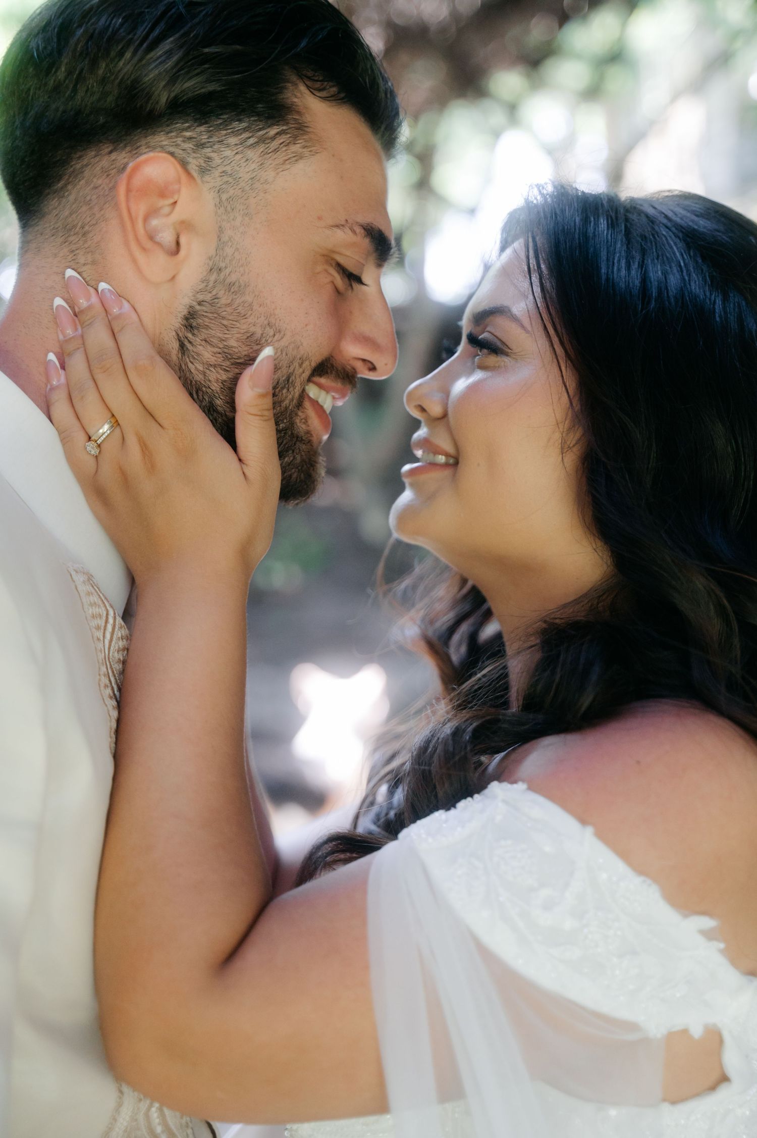 A romantic moment captured in a series of candid wedding photos showing a couple laughing and embracing outdoors.