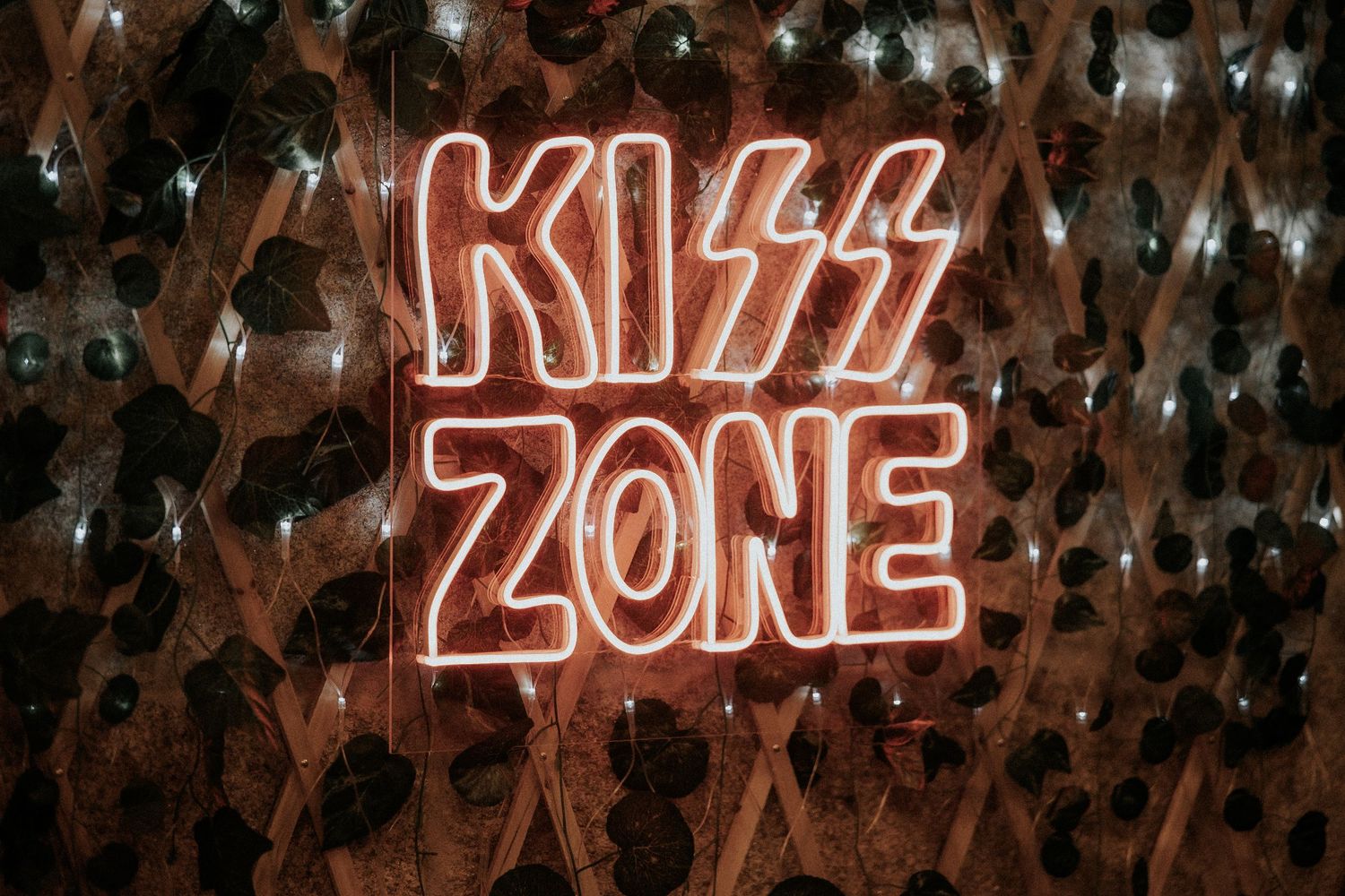 Neon signs spelling 'CHILL ZONE' glow against a dark background with twinkling lights.