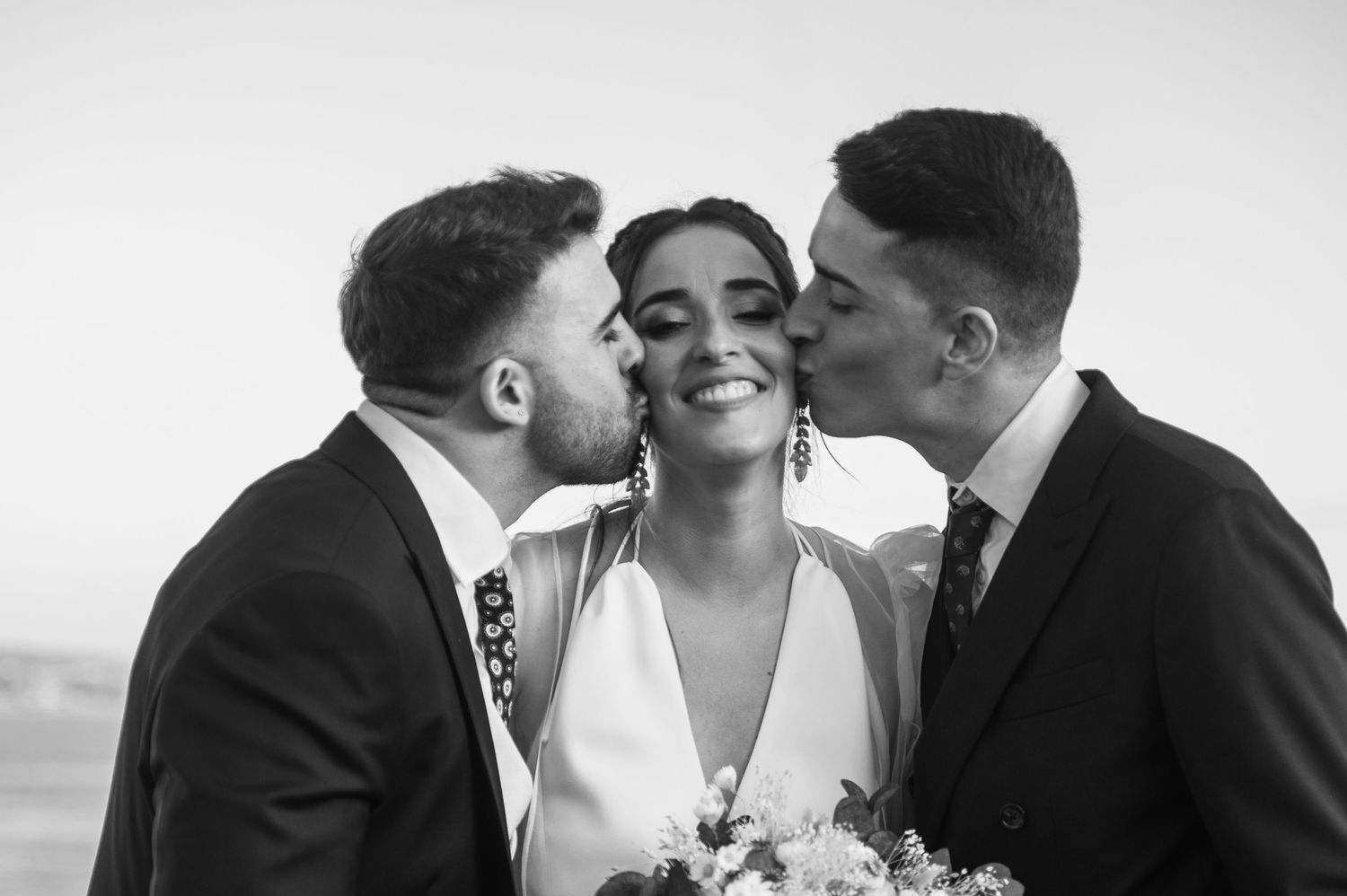 Black and white wedding photo collage showing romantic moments between newlyweds in formal attire.