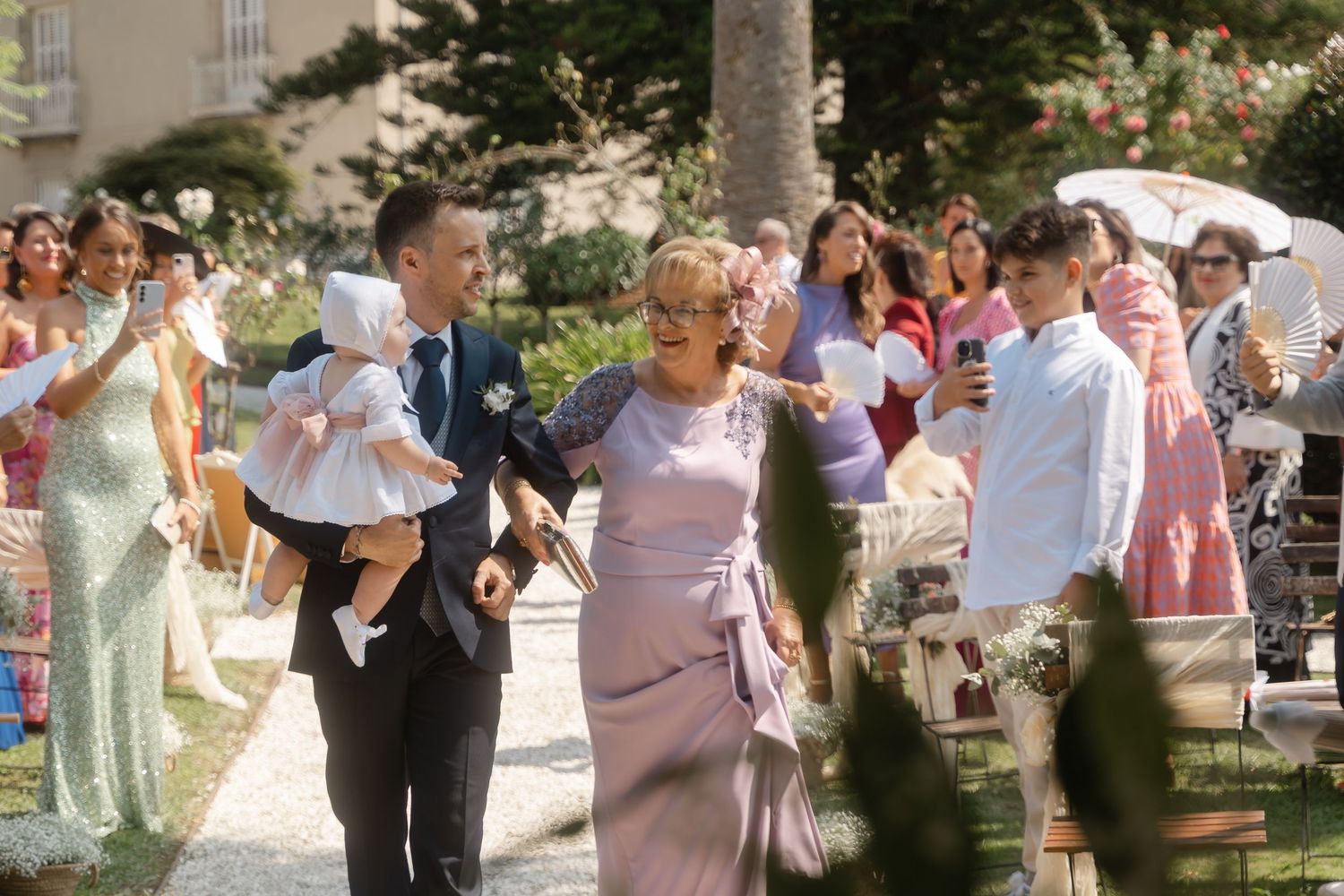 A series of wedding celebration photos showing guests dancing and mingling at an outdoor reception venue.