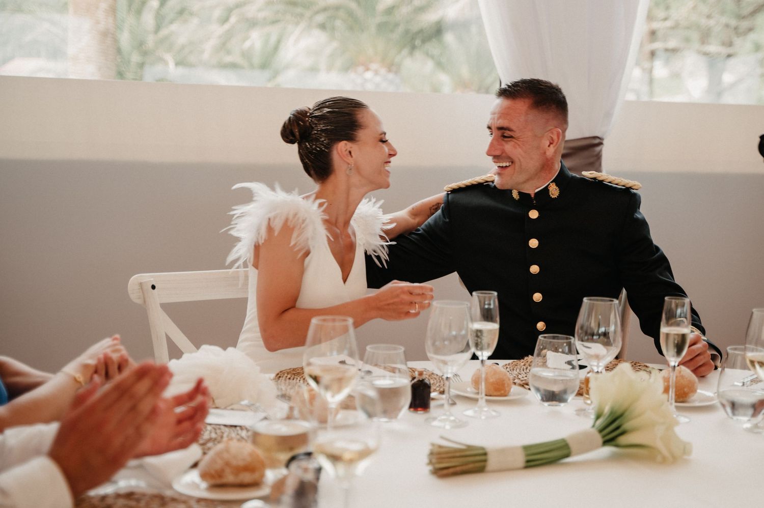 A series of candid reception photos showing a couple laughing and enjoying their wedding celebration at a table.
