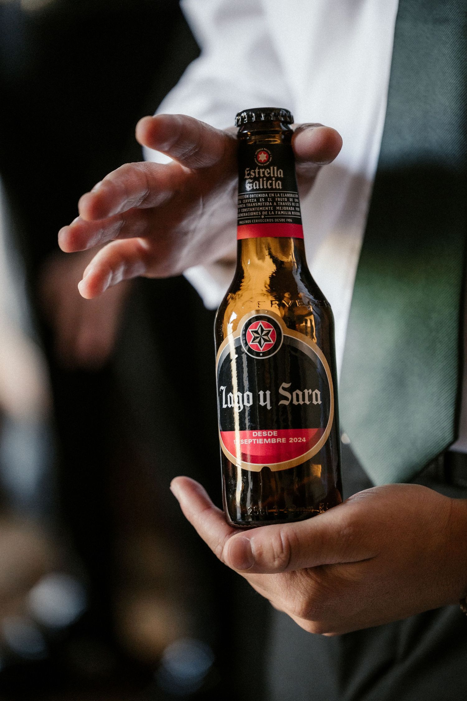 Close-up shots of dark beer bottles being held against a blurred background.