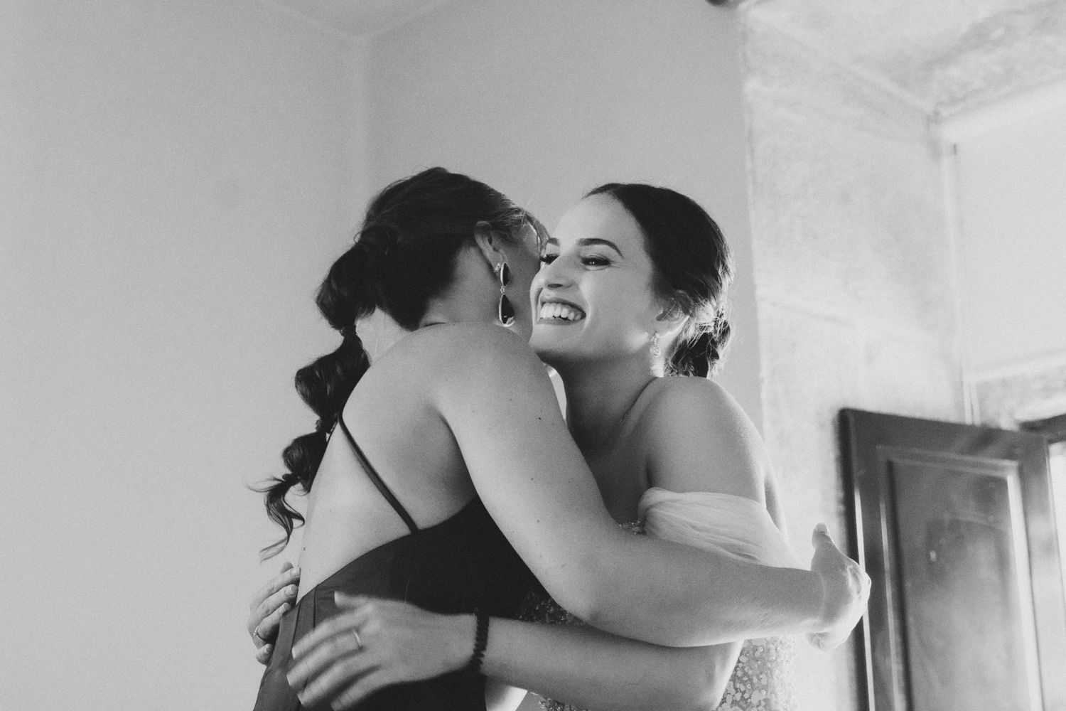 Black and white photo series showing a couple embracing and dancing together in an intimate moment.