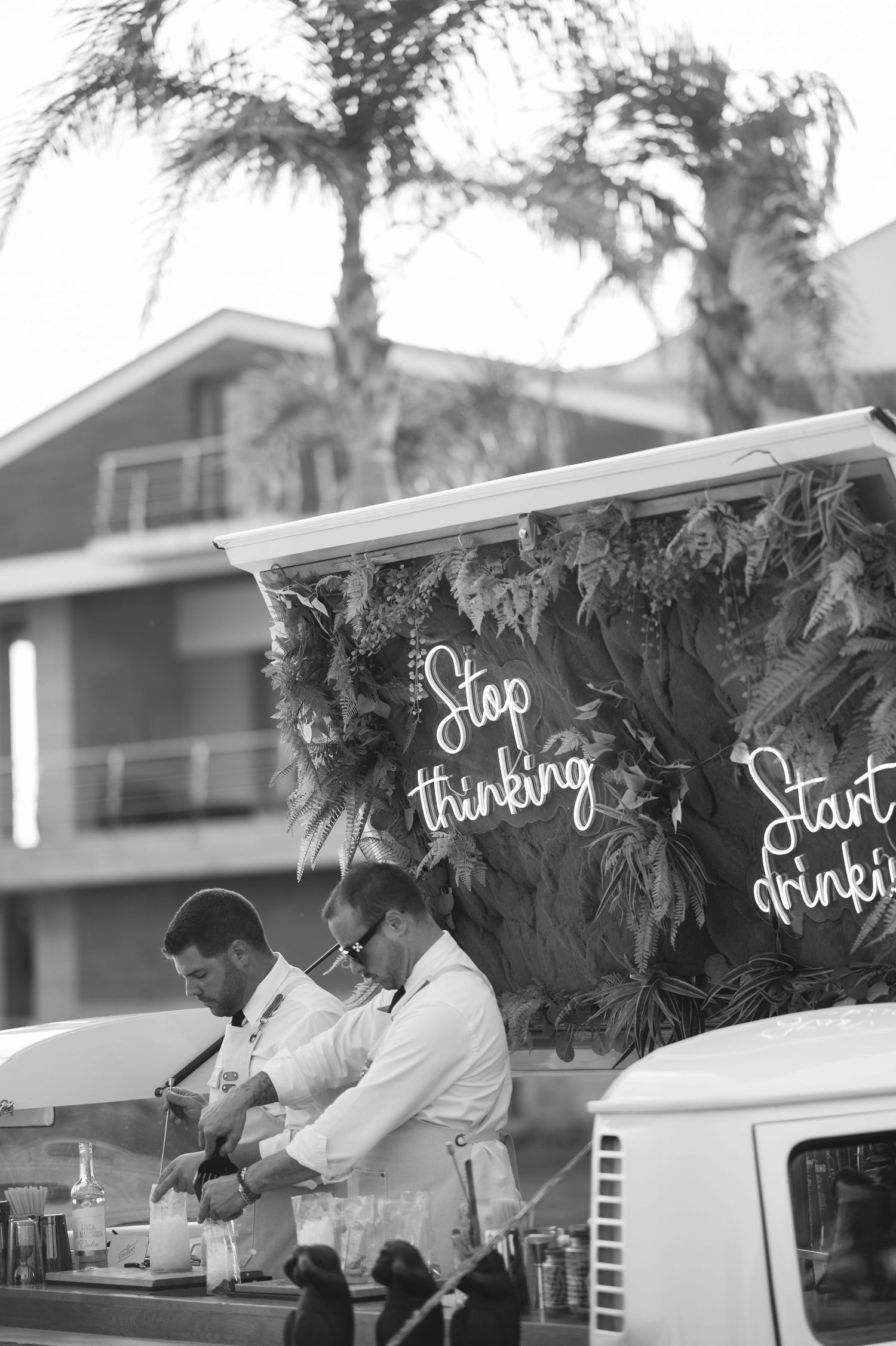 Black and white photo sequence showing a stop thinking start doing motivational message with tropical foliage decor.