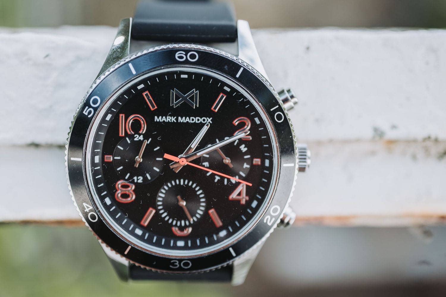 Close-up of modern black chronograph watch faces showing time and subdials.