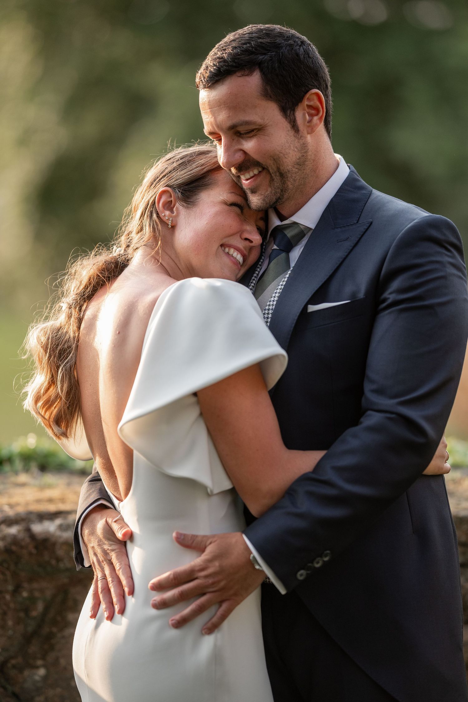 A romantic series of wedding photos showing a couple embracing and laughing together outdoors in natural lighting.