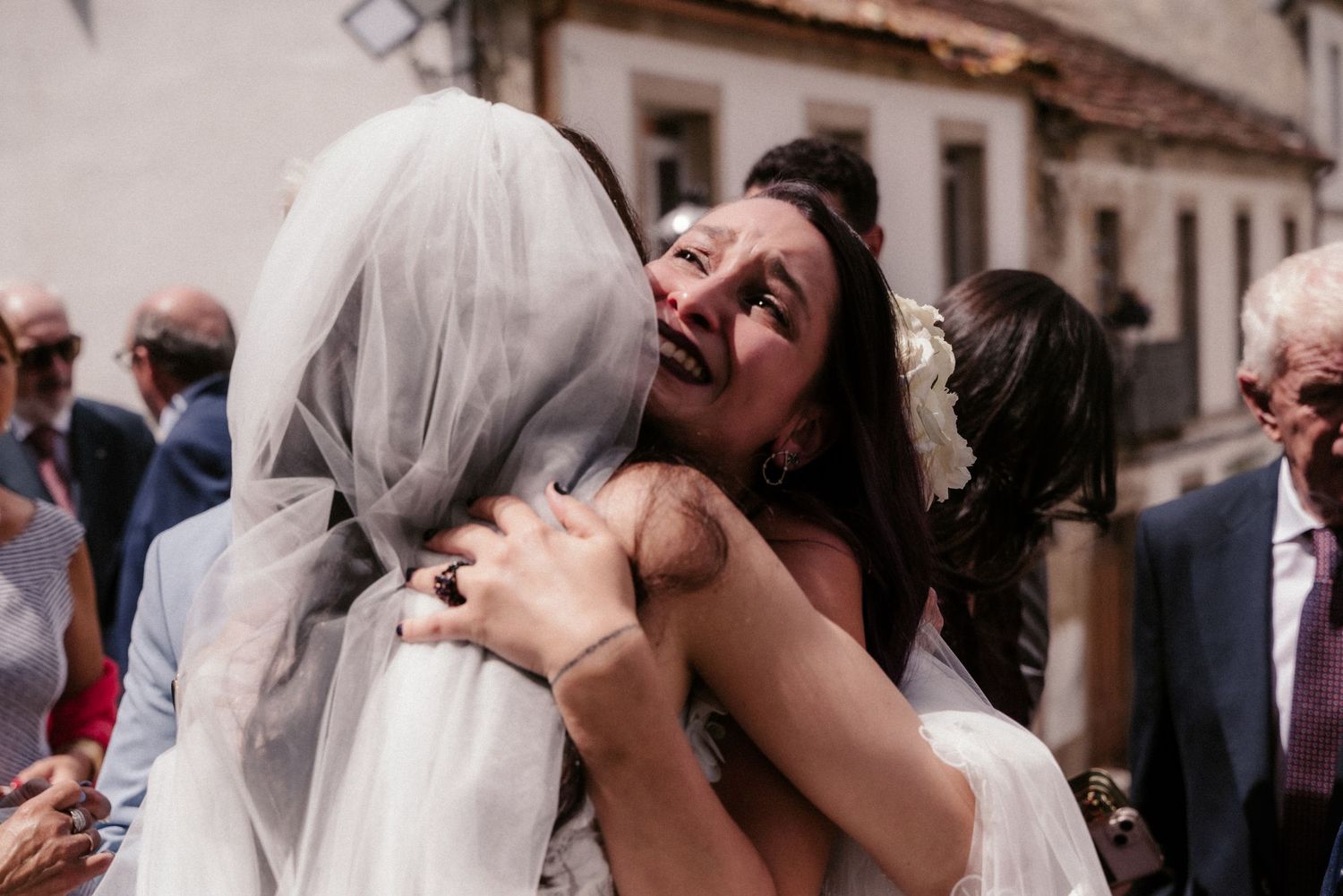 Romantic wedding couple sharing intimate kisses and embraces during their celebration.