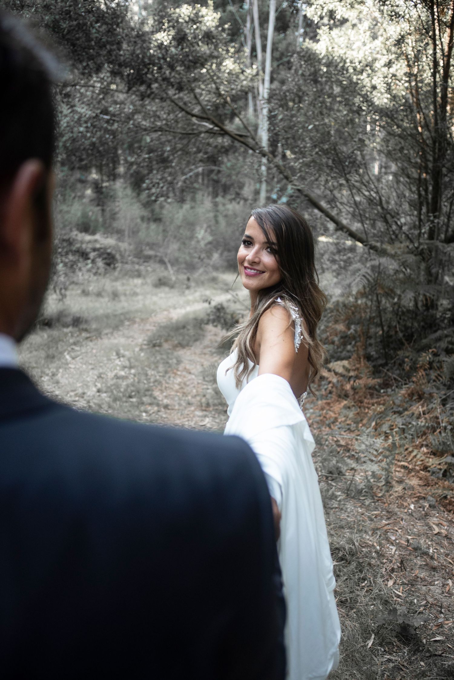A series of romantic forest engagement photos showing a couple in a wooded setting with soft natural lighting.