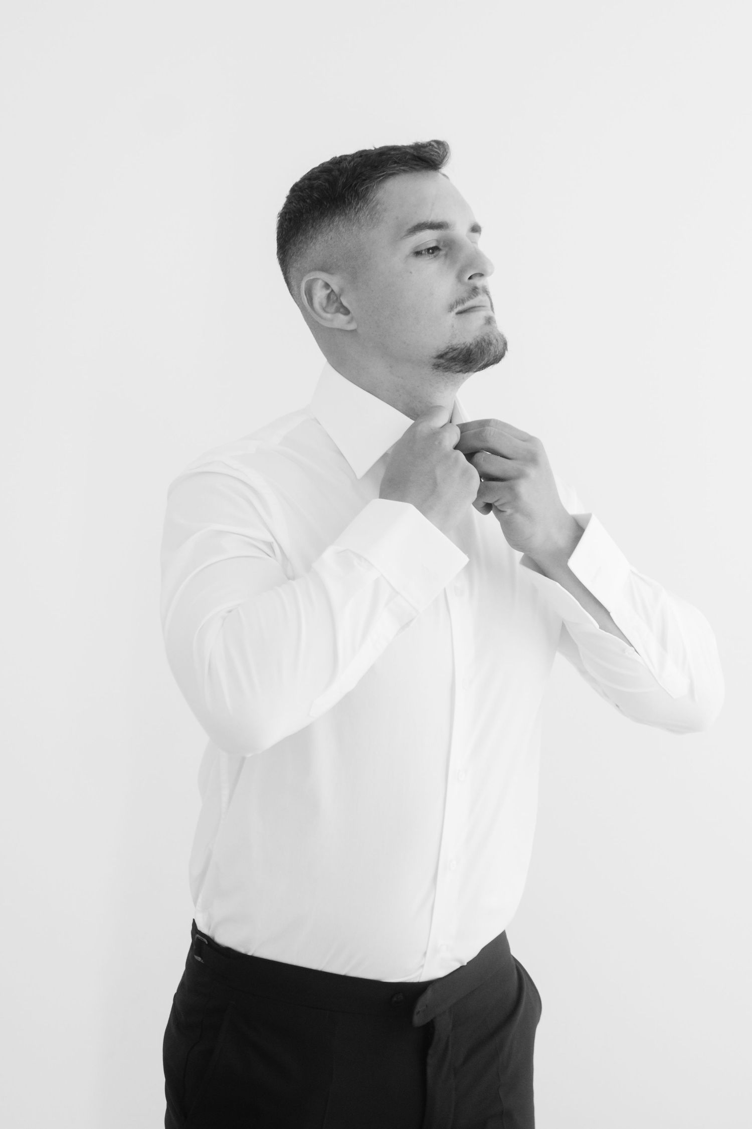 A series of black and white artistic portrait shots showing expressive poses against a white background.