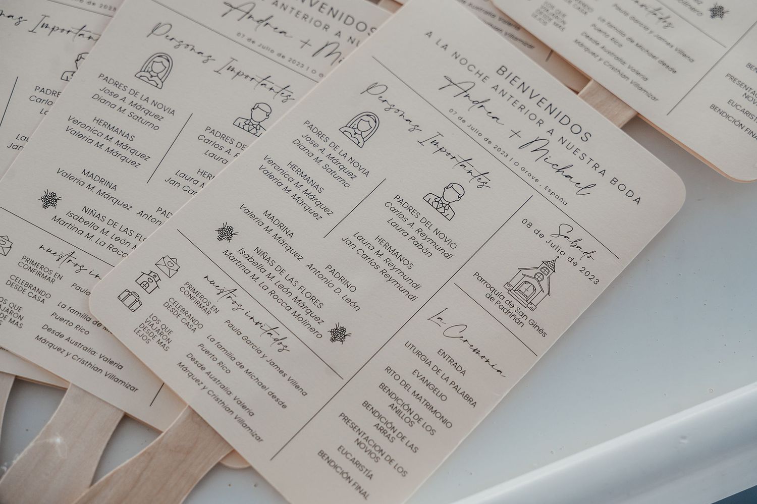 A collection of handwritten paper notes and documents arranged in a neat spread on a reflective surface.