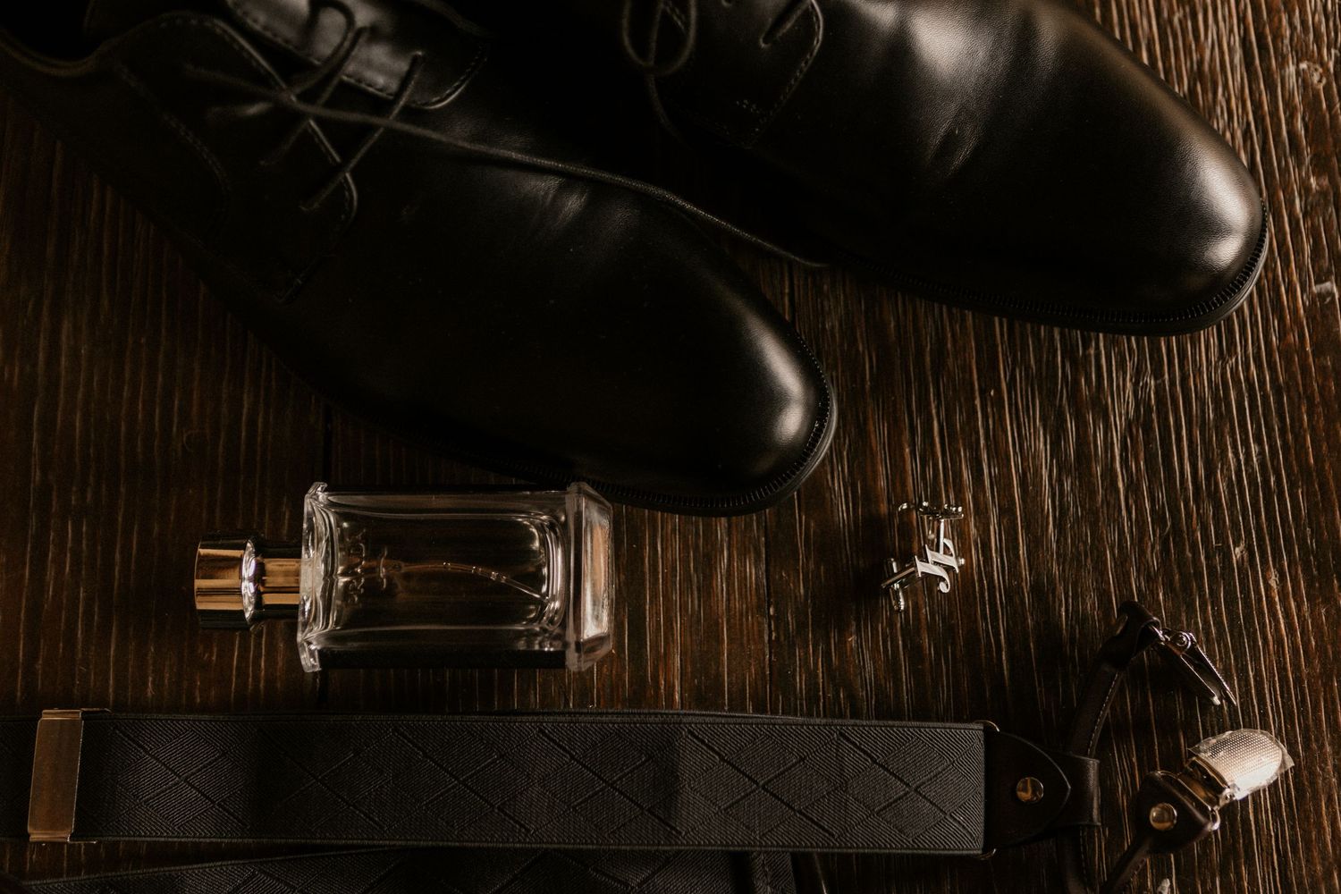 A collection of vintage glass vacuum tubes displayed on a rustic wooden surface with dramatic lighting.