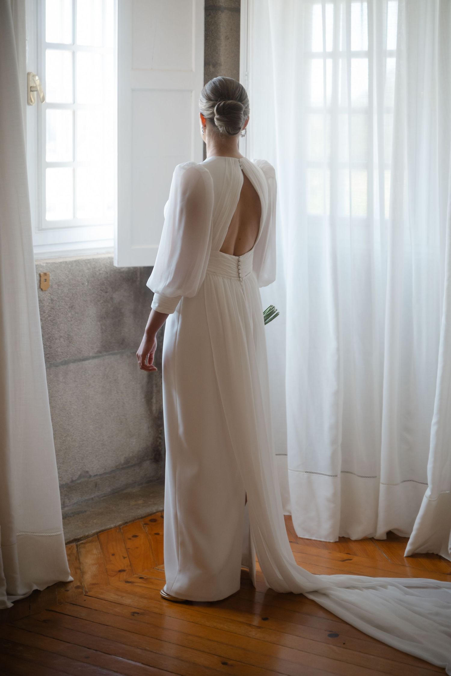 A sequence of photographs showing someone in a flowing white dress standing near sunlit windows on a wooden floor.