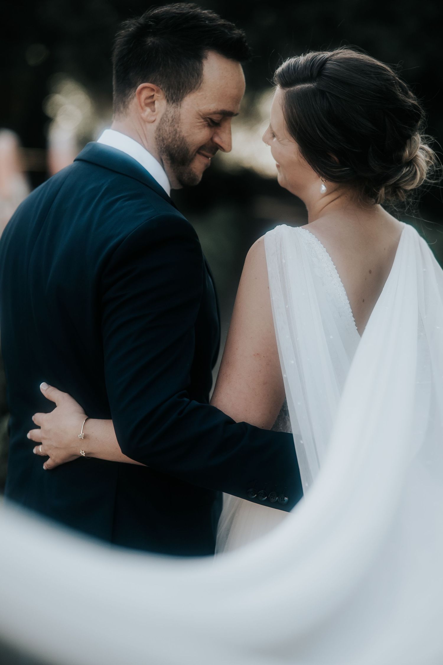 Artistic wedding photography series showing flowing veil movement against dark background.