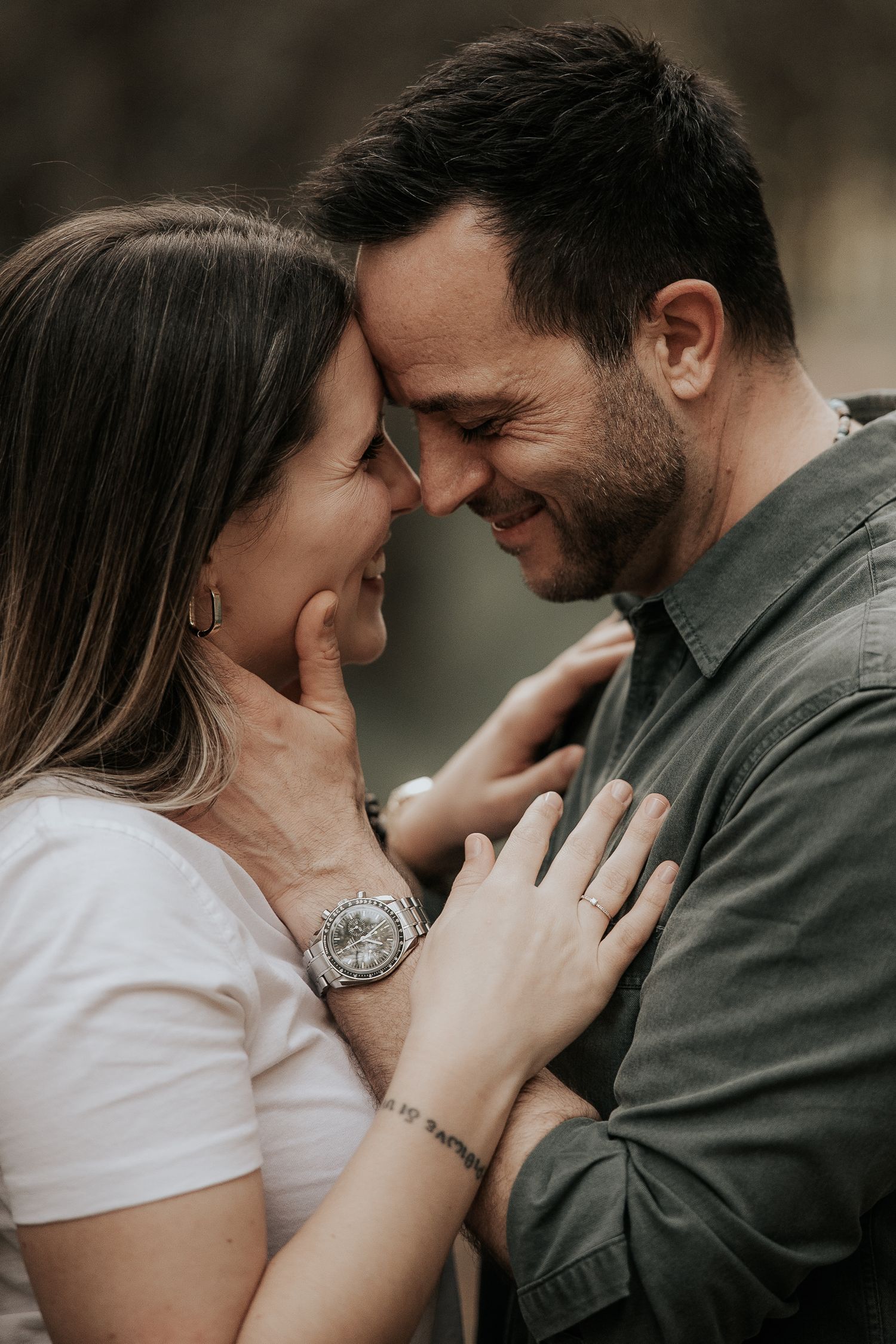 Intimate series of romantic close-up shots showing tender moments between a couple in moody lighting.