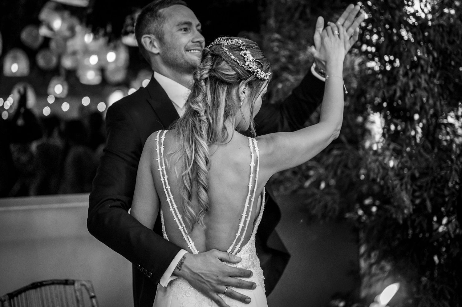 A black and white collage of wedding photos showing romantic dance poses and intimate moments at a reception.