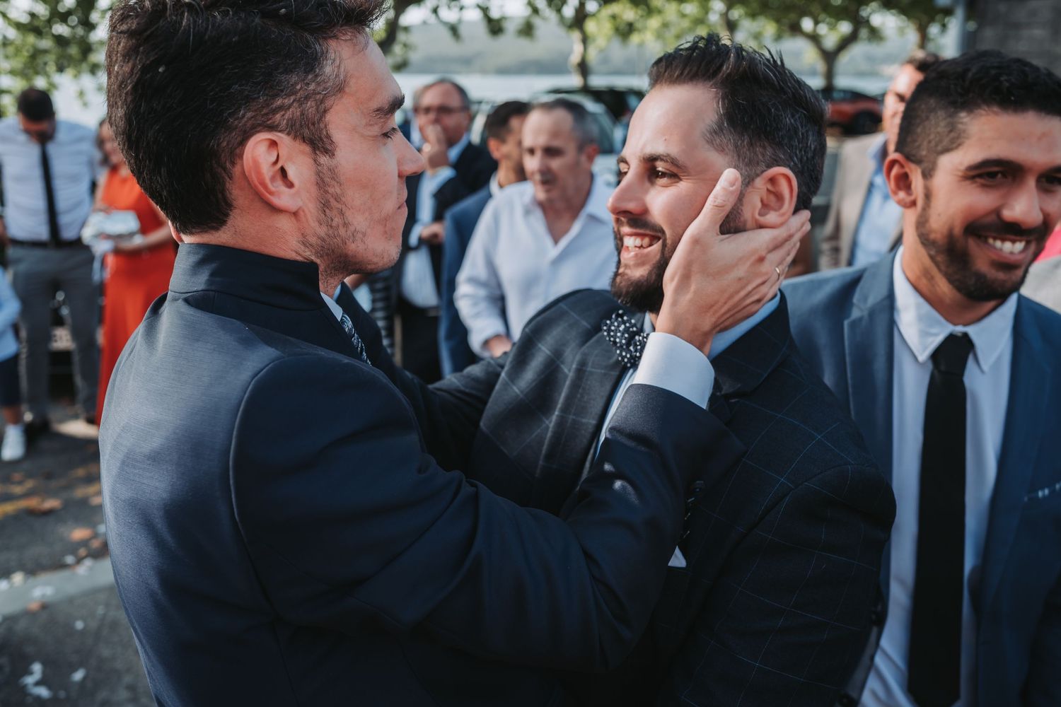A sequence of candid moments showing people in formal attire sharing joyful reactions and conversations at an event.