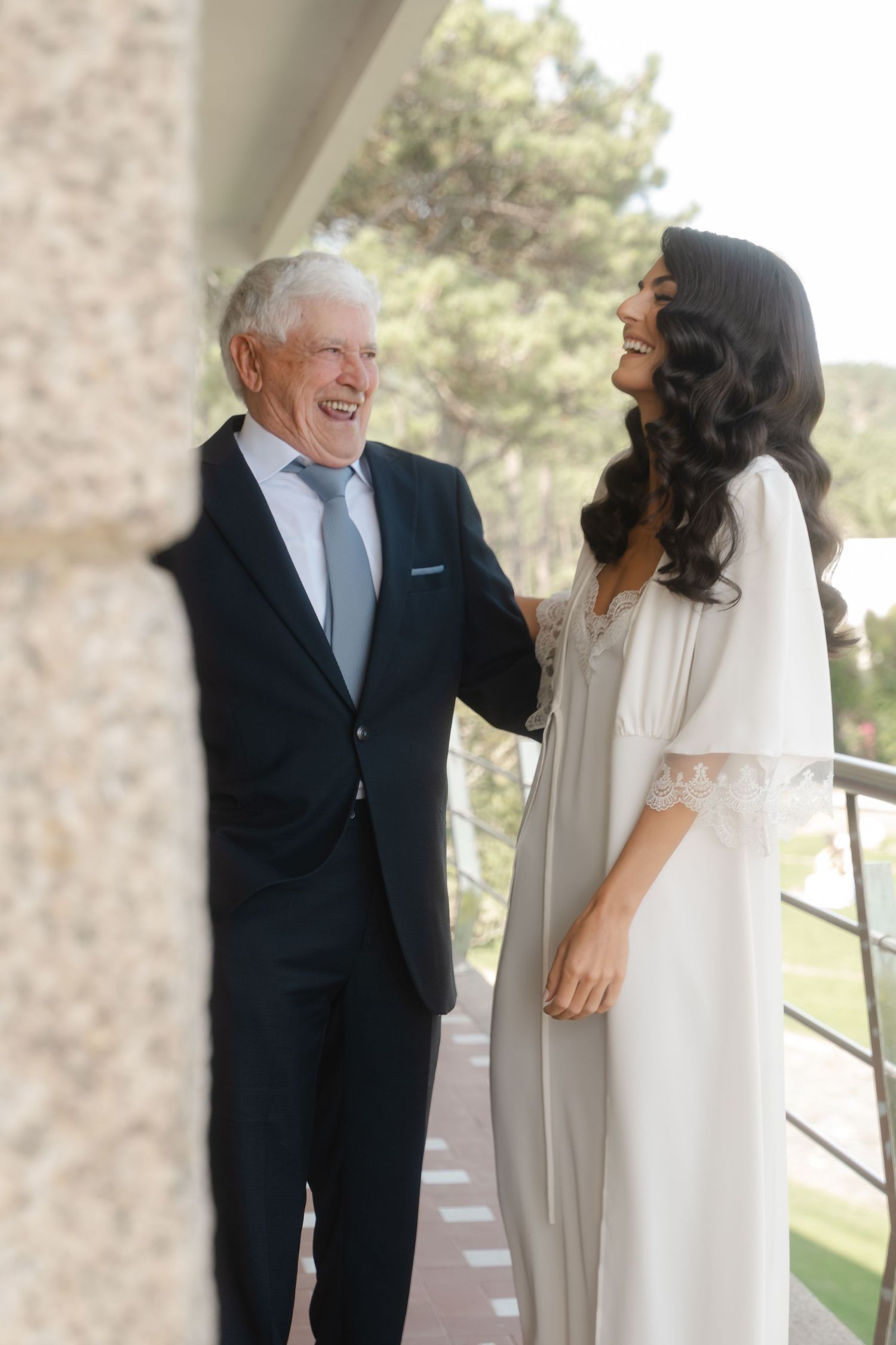 Joyful wedding day moment captured outdoors with natural lighting.