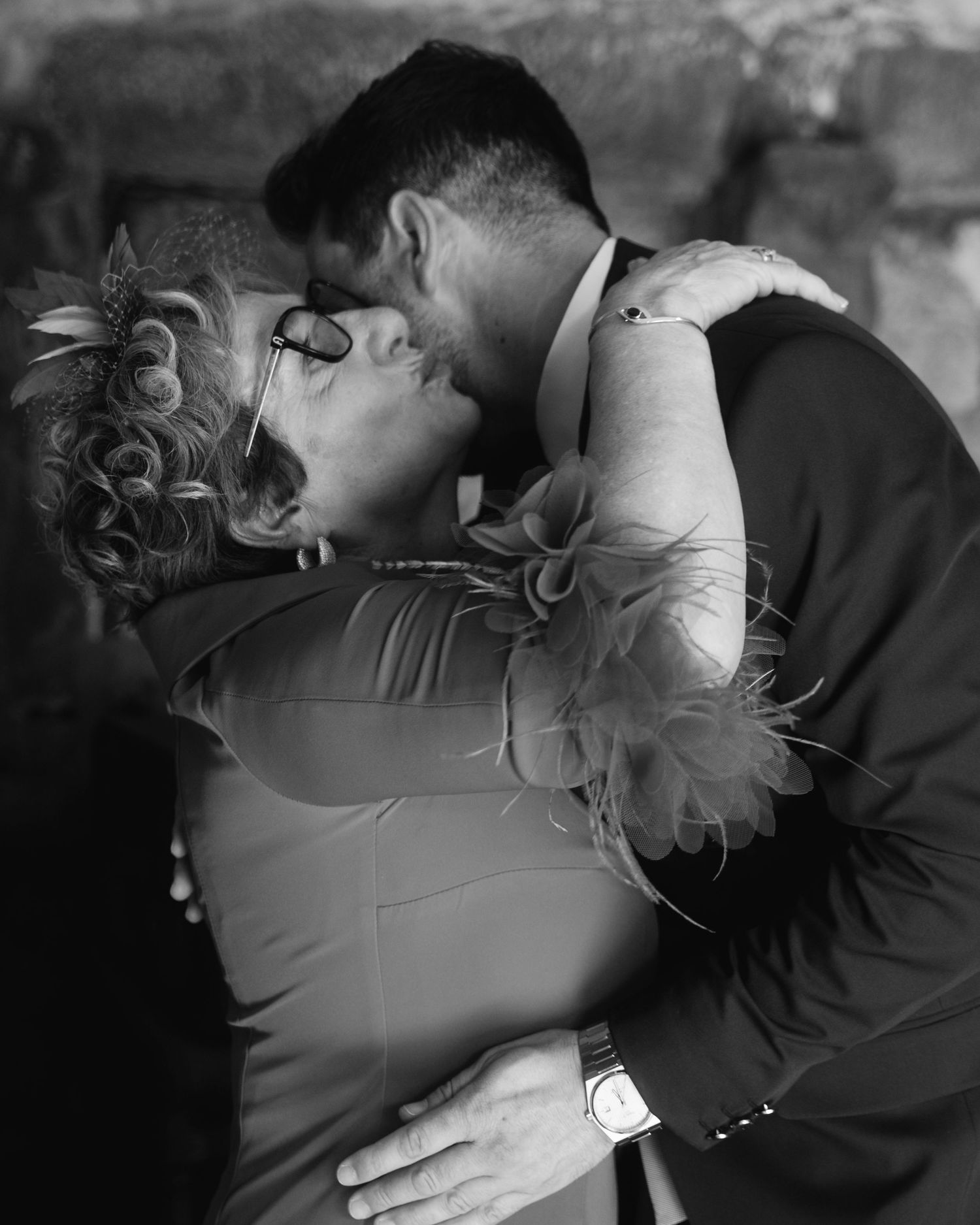 A series of black and white romantic photographs showing tender embraces between two people.