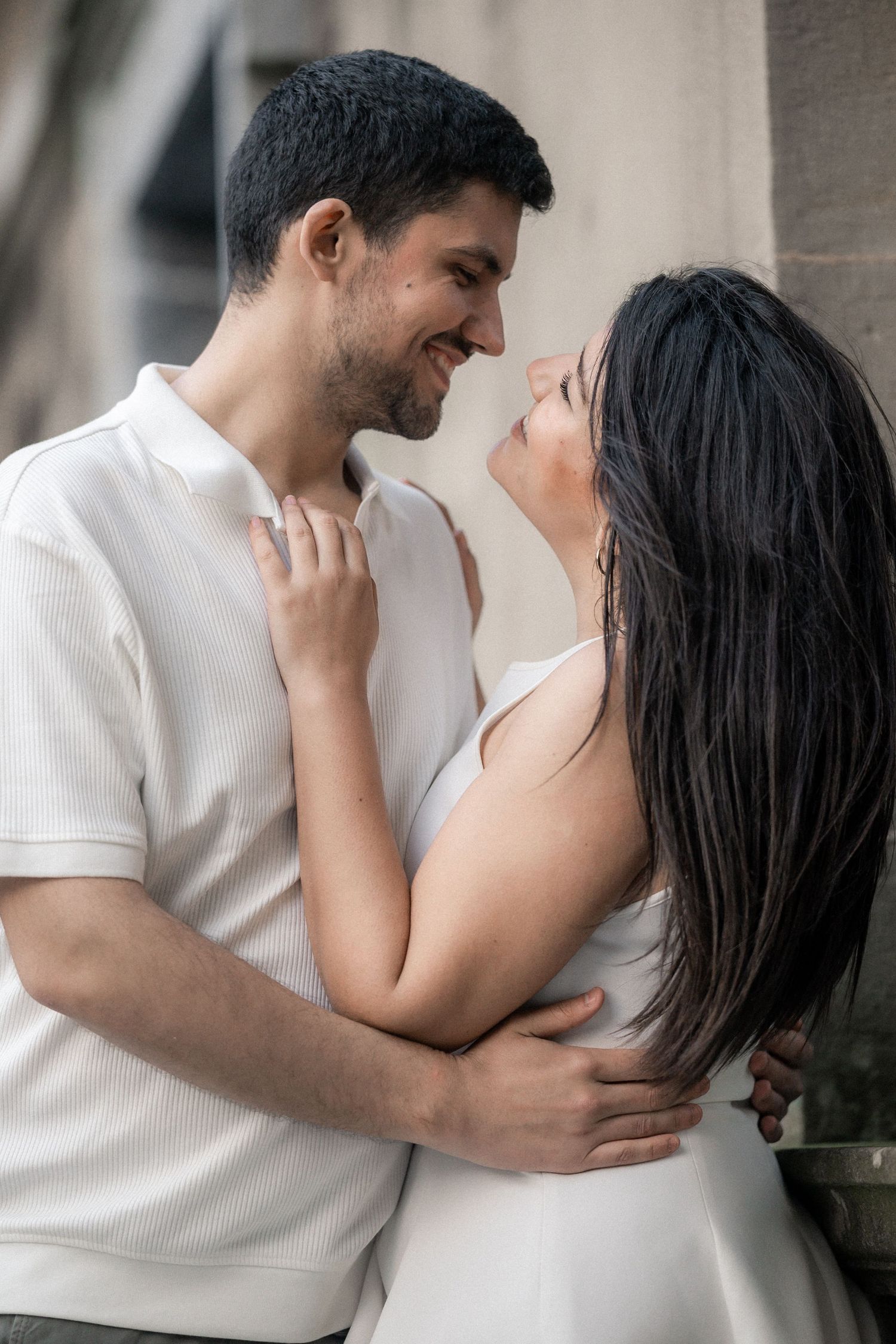 Romantic couple in white embraces tenderly in a series of intimate portrait shots showing their affection and connection.