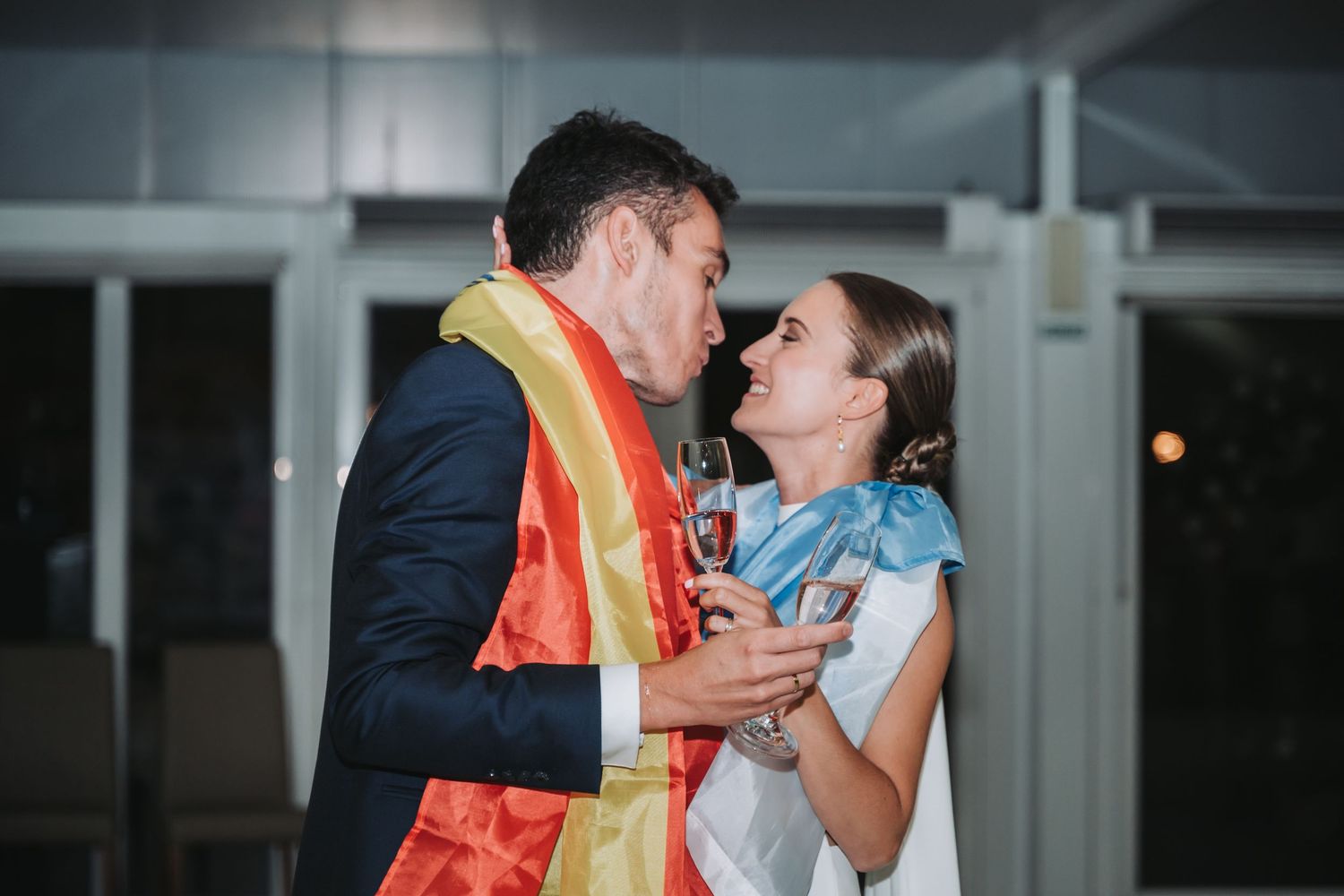 A couple shares an intimate moment during their wedding reception dance.