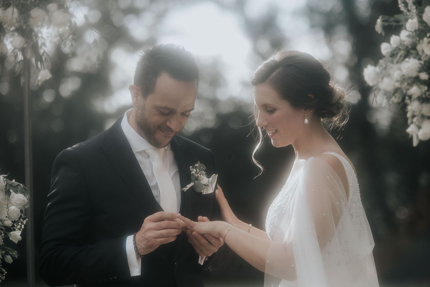 Joyful wedding couple shares intimate moments in a series of romantic black and white portraits.