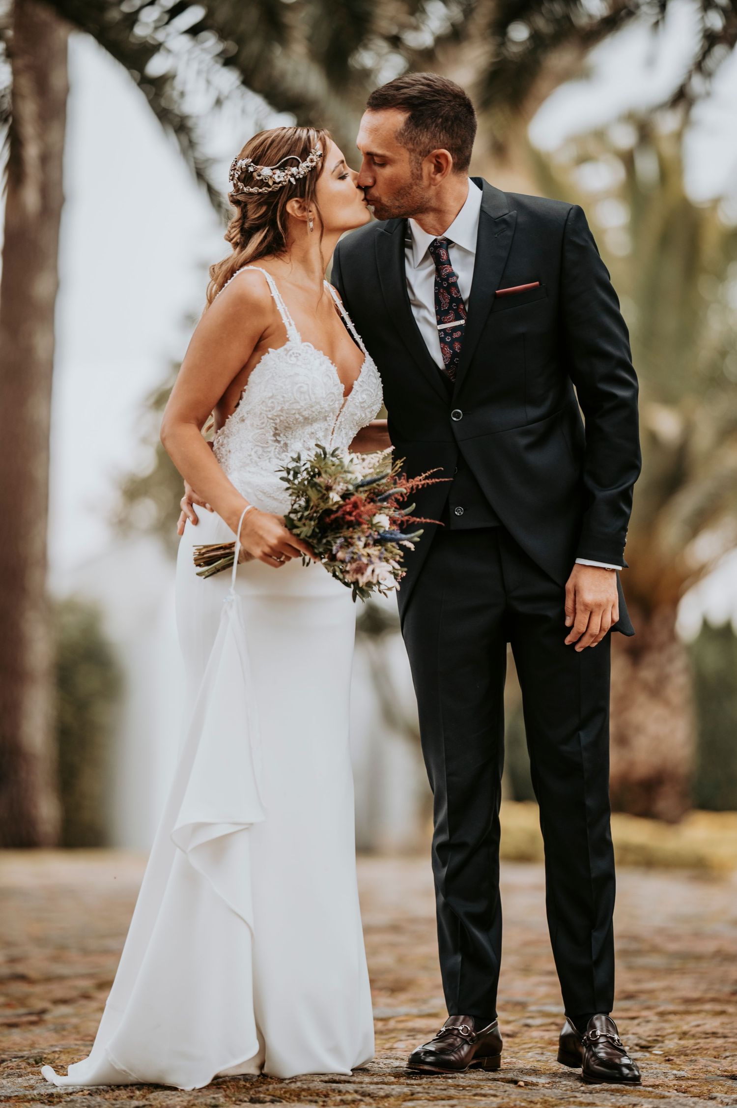 A romantic wedding photo series showing close-up details of a bride and groom in a wooded outdoor setting.
