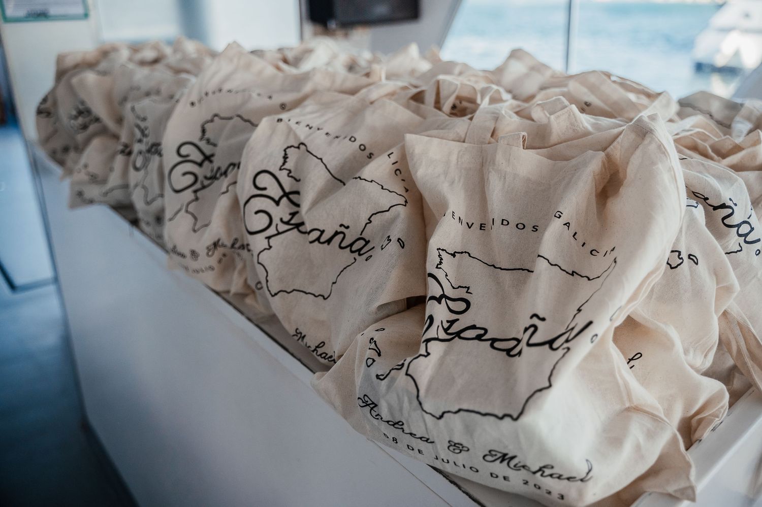 Crumpled paper with handwritten text and sketches lies scattered across a blue surface.