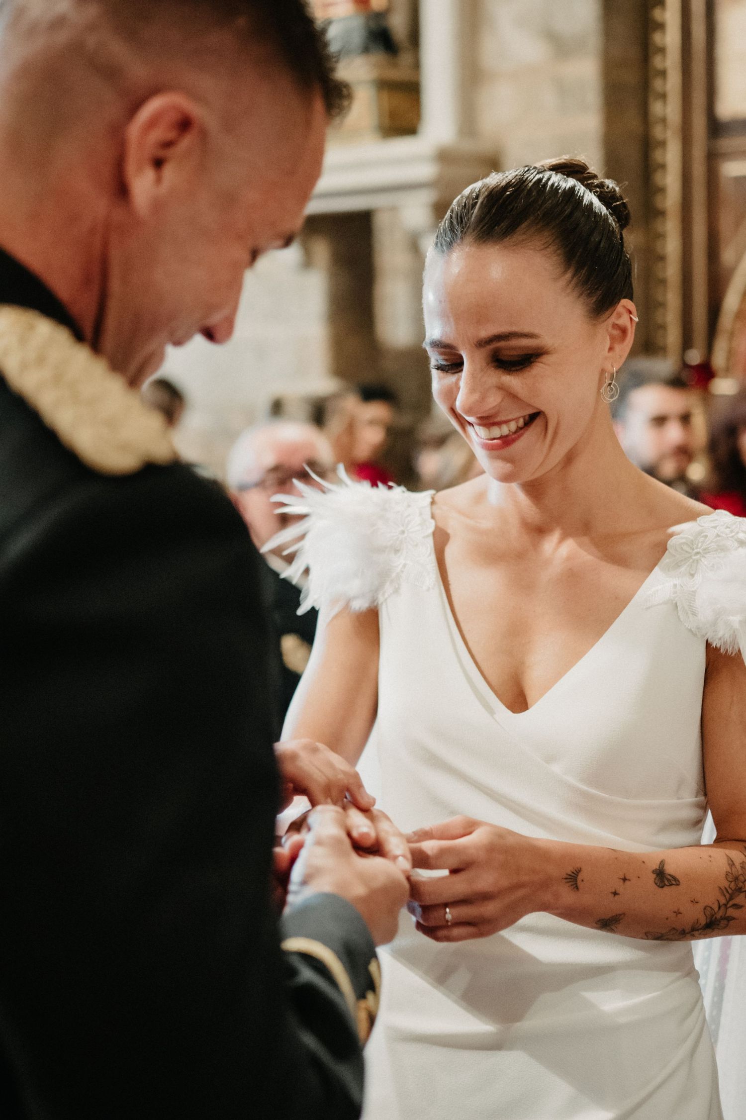 Close-up shots of a couple's hands exchanging rings during an intimate wedding ceremony.