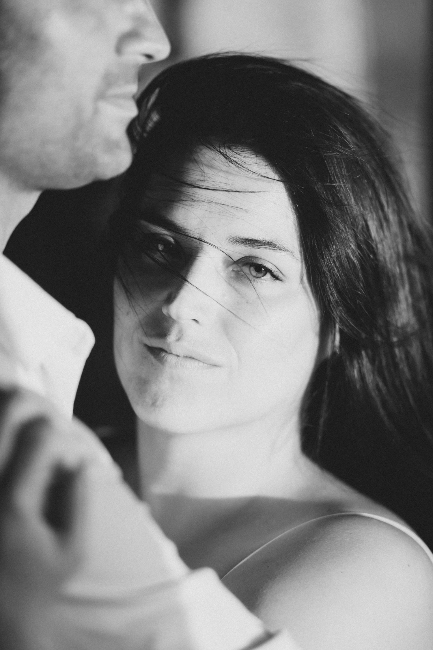 Artistic black and white portrait series capturing intimate moments between two people.
