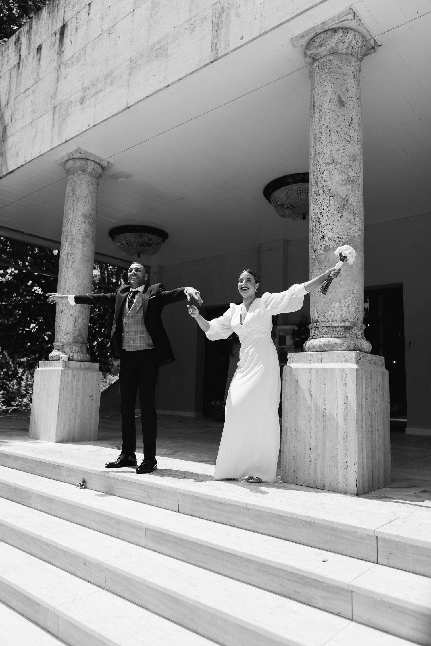A sequence of black and white photos showing people dancing on white marble steps with classical columns.