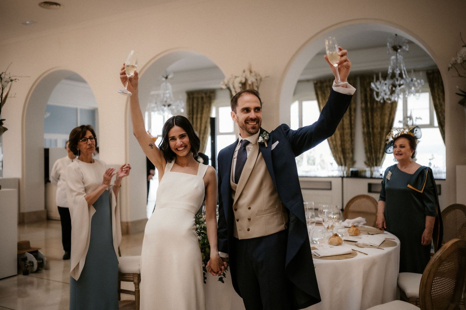 A sequence of candid wedding moments showing celebration, dancing, and joyful interactions at an elegant indoor venue.