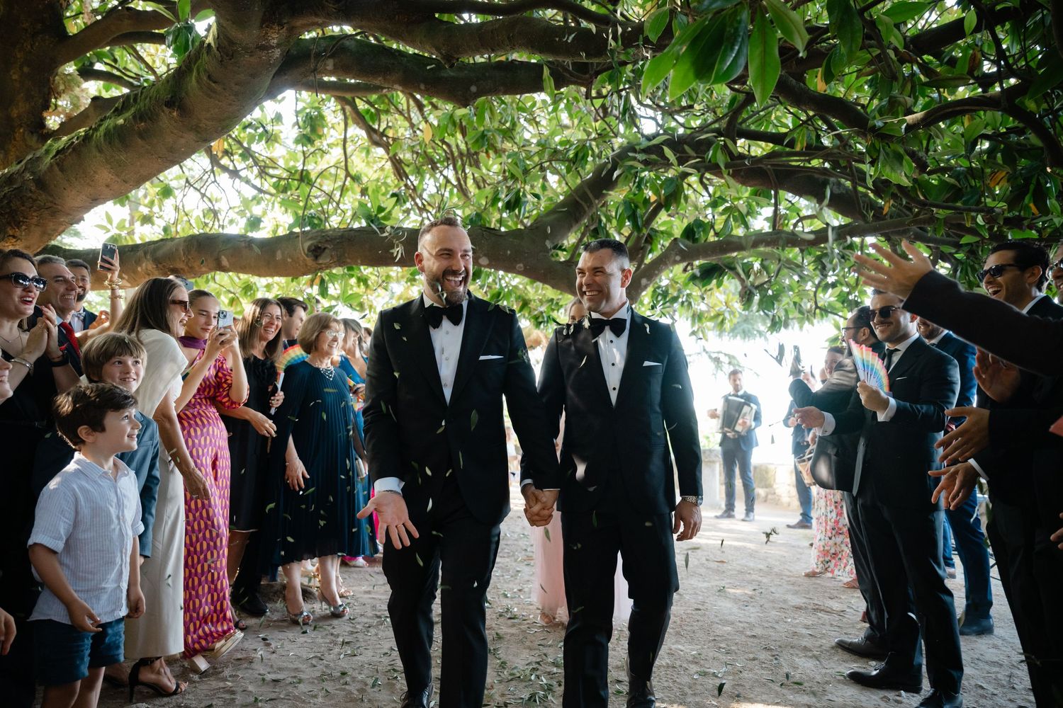 A sequence of wedding celebration moments captured under trees with guests and wedding party members gathered outdoors.