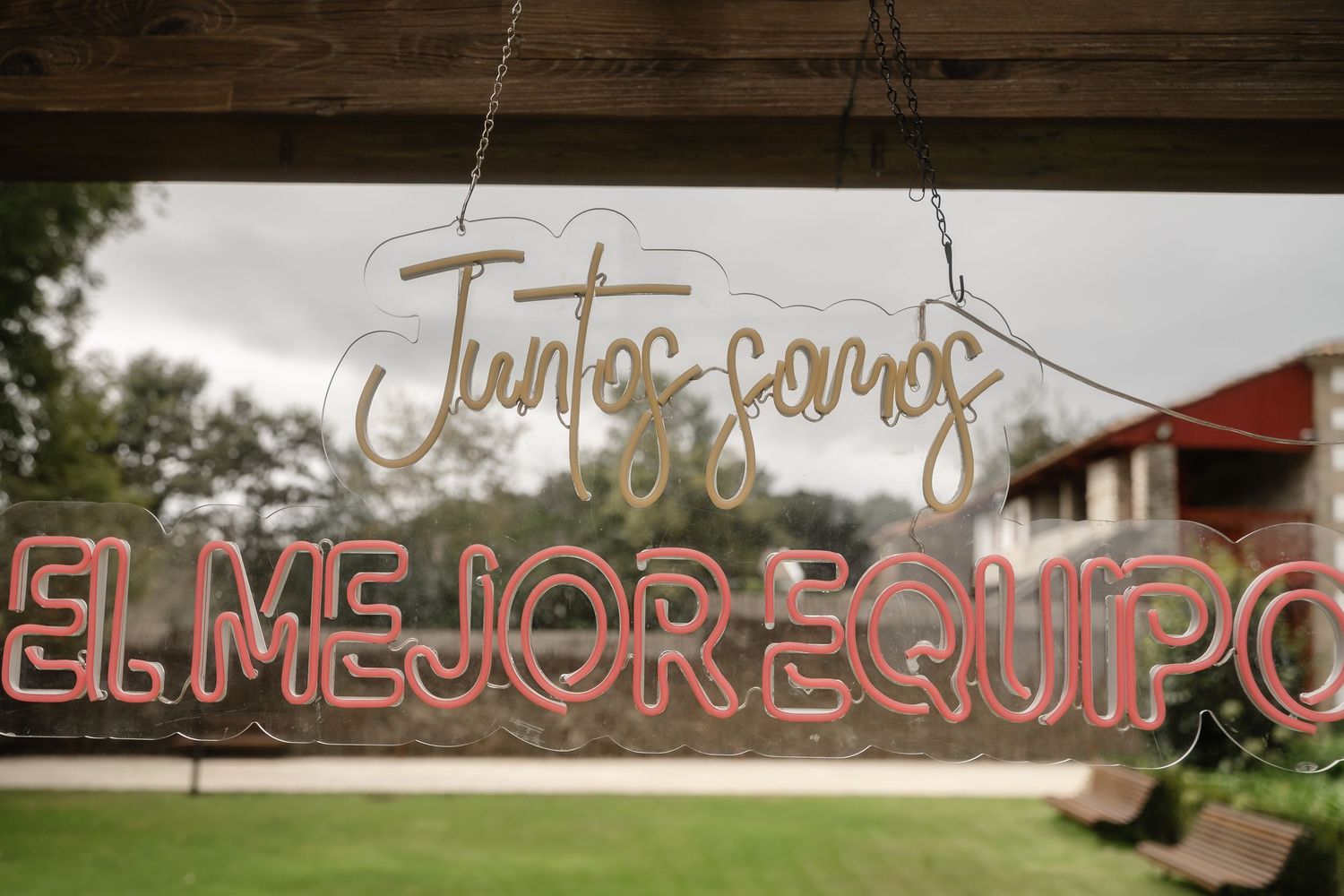 A rustic wooden wall with multiple neon signs and text displays creating an ambient atmosphere.