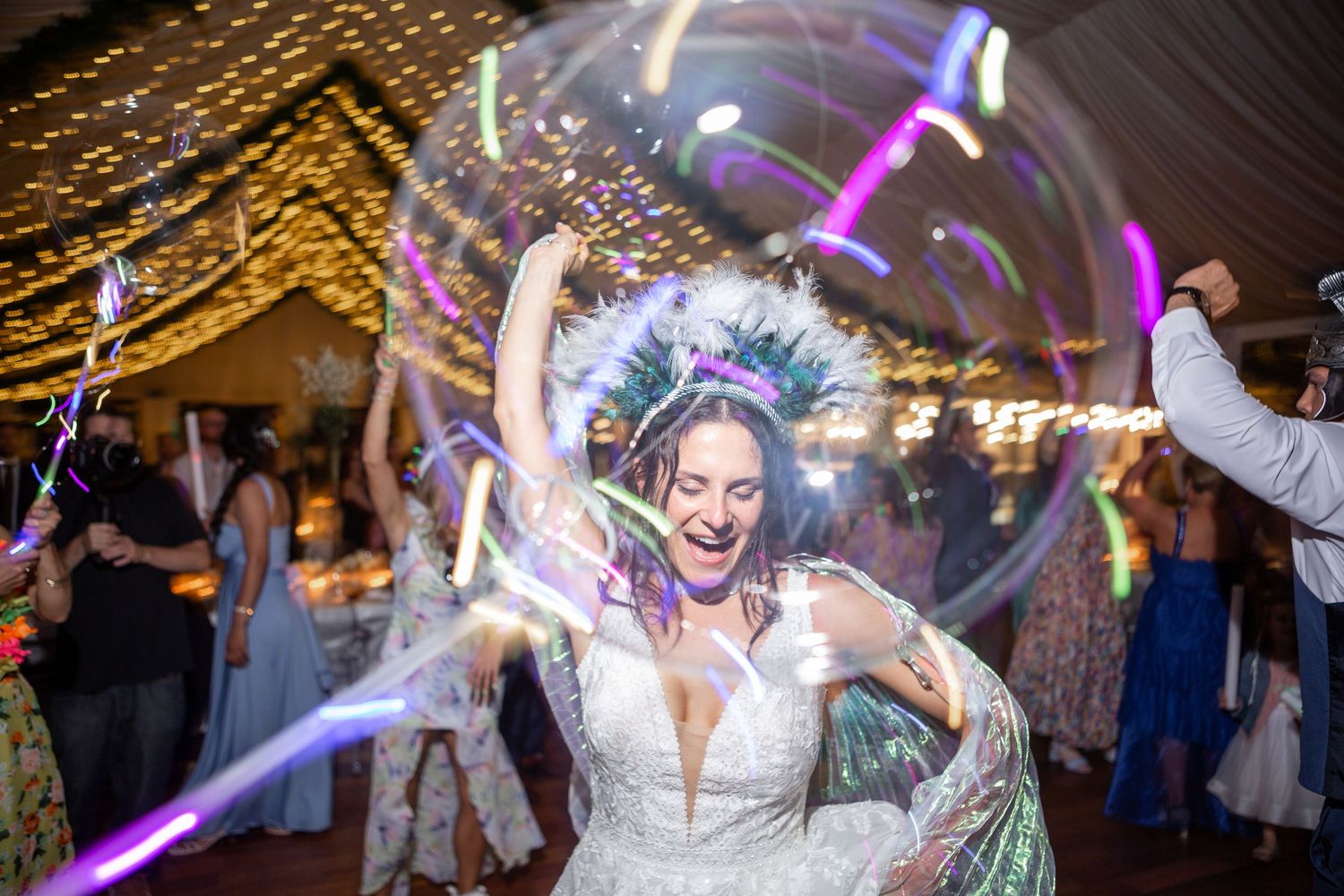 Wedding reception dance floor with colorful lights and celebratory atmosphere.