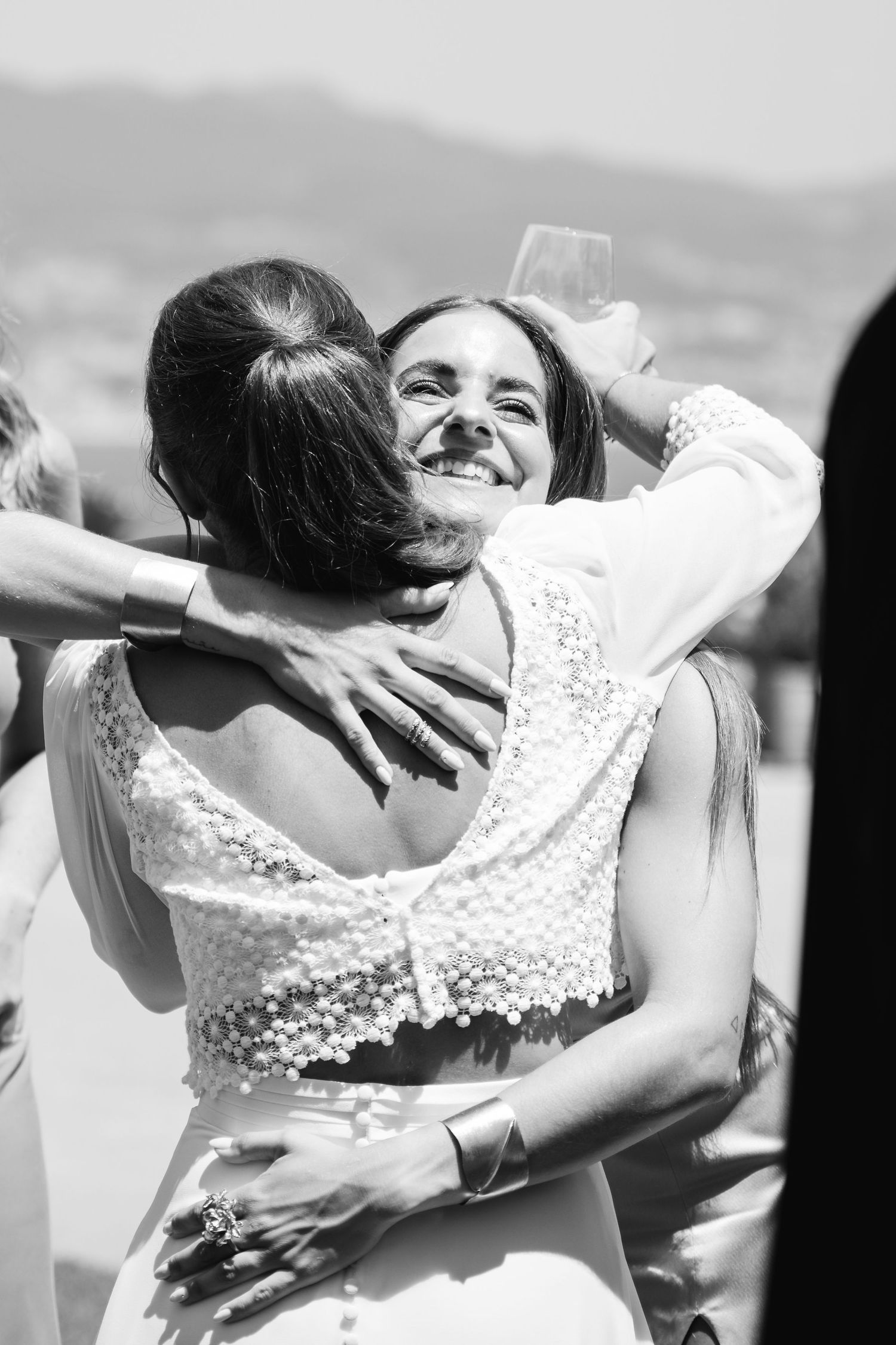 A sequence of black and white photos showing an intimate embrace between two people in formal attire.