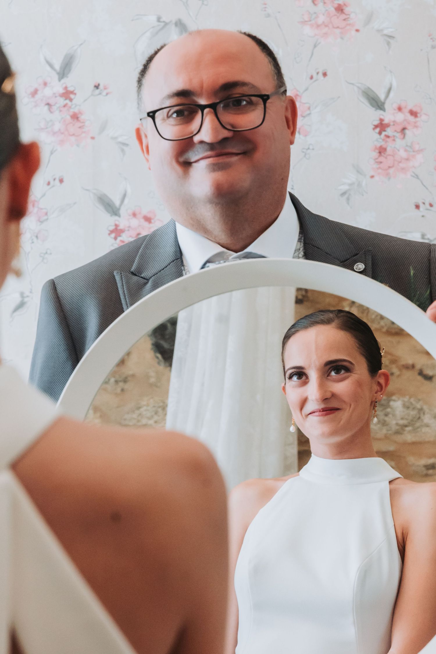 Wedding preparation scene with floral decorations and soft natural lighting.