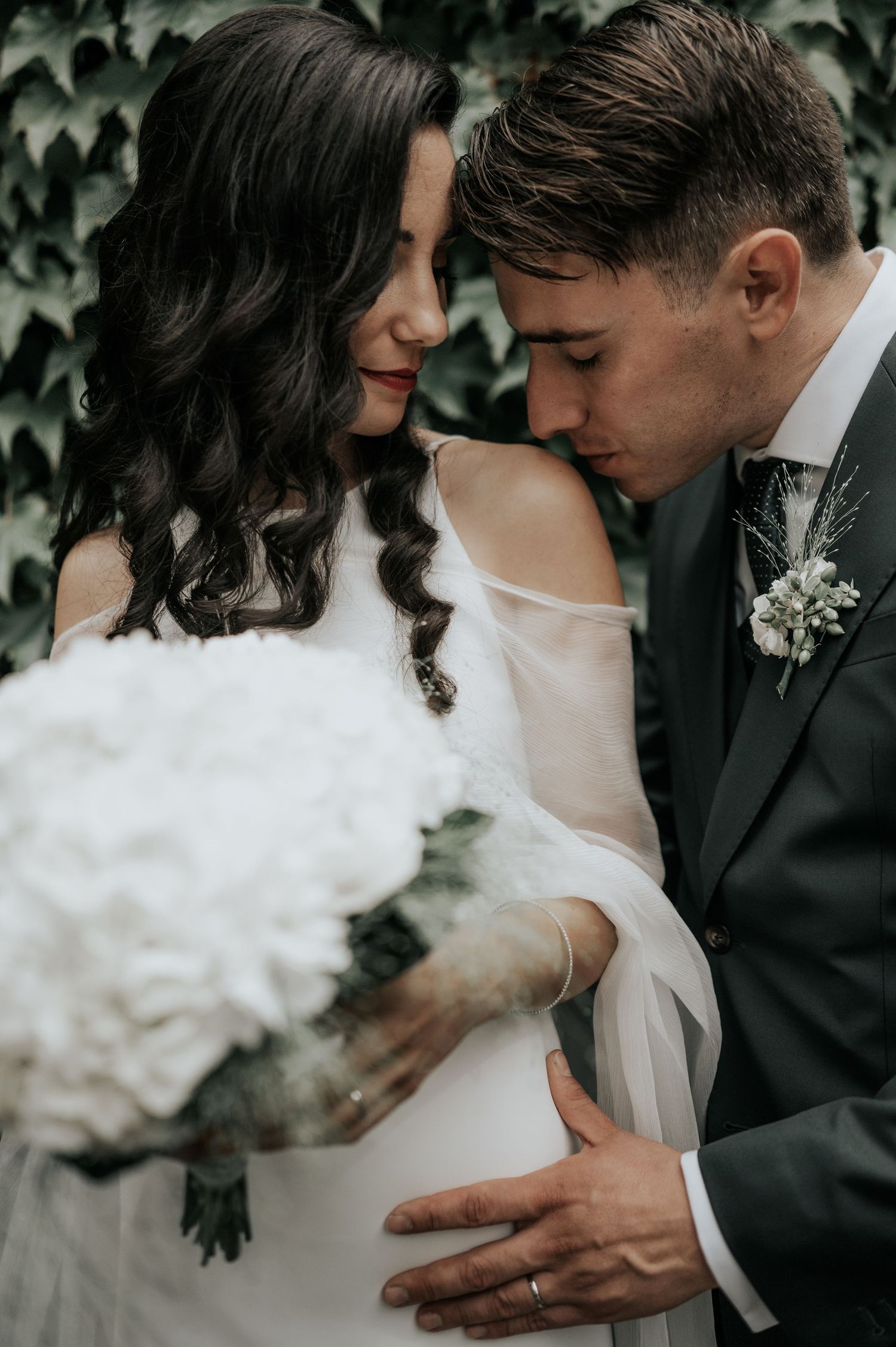 A romantic wedding moment captured in an intimate series of black and white photographs.
