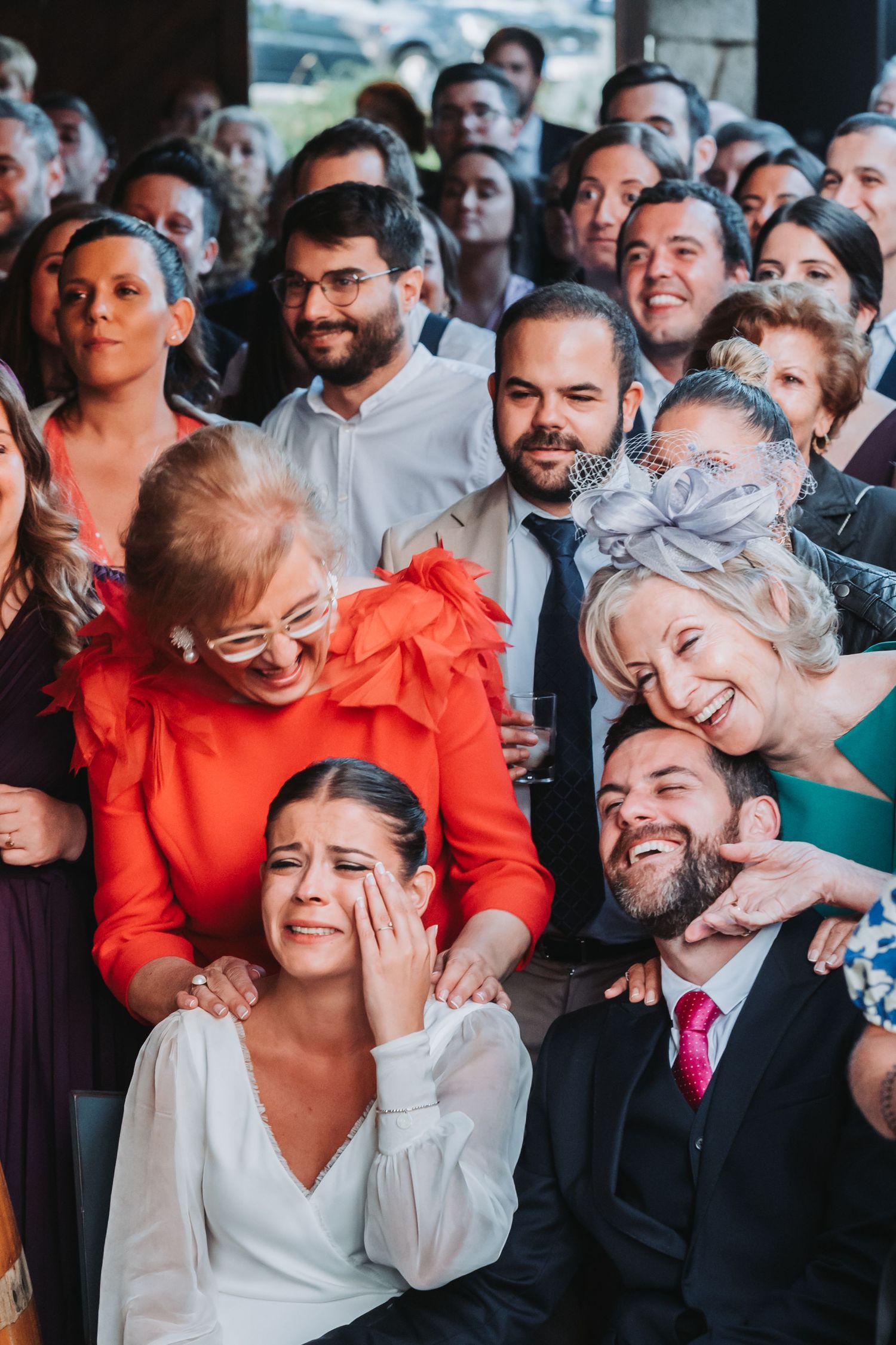 A series of candid wedding photos showing joyful reactions and laughter during a celebration.